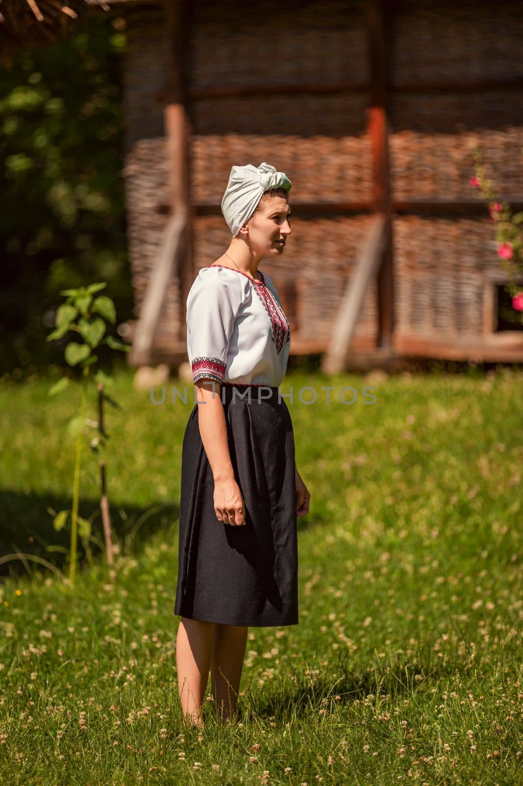 young woman in ukrainian national costume outdoors