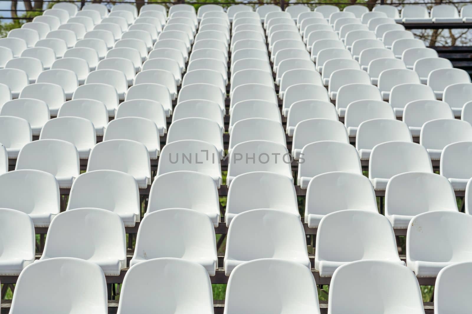 Seats of tribune on sport stadium. Concept of fans, chairs for audience, cultural environment concept. mpty seats, modern stadium. by Matiunina