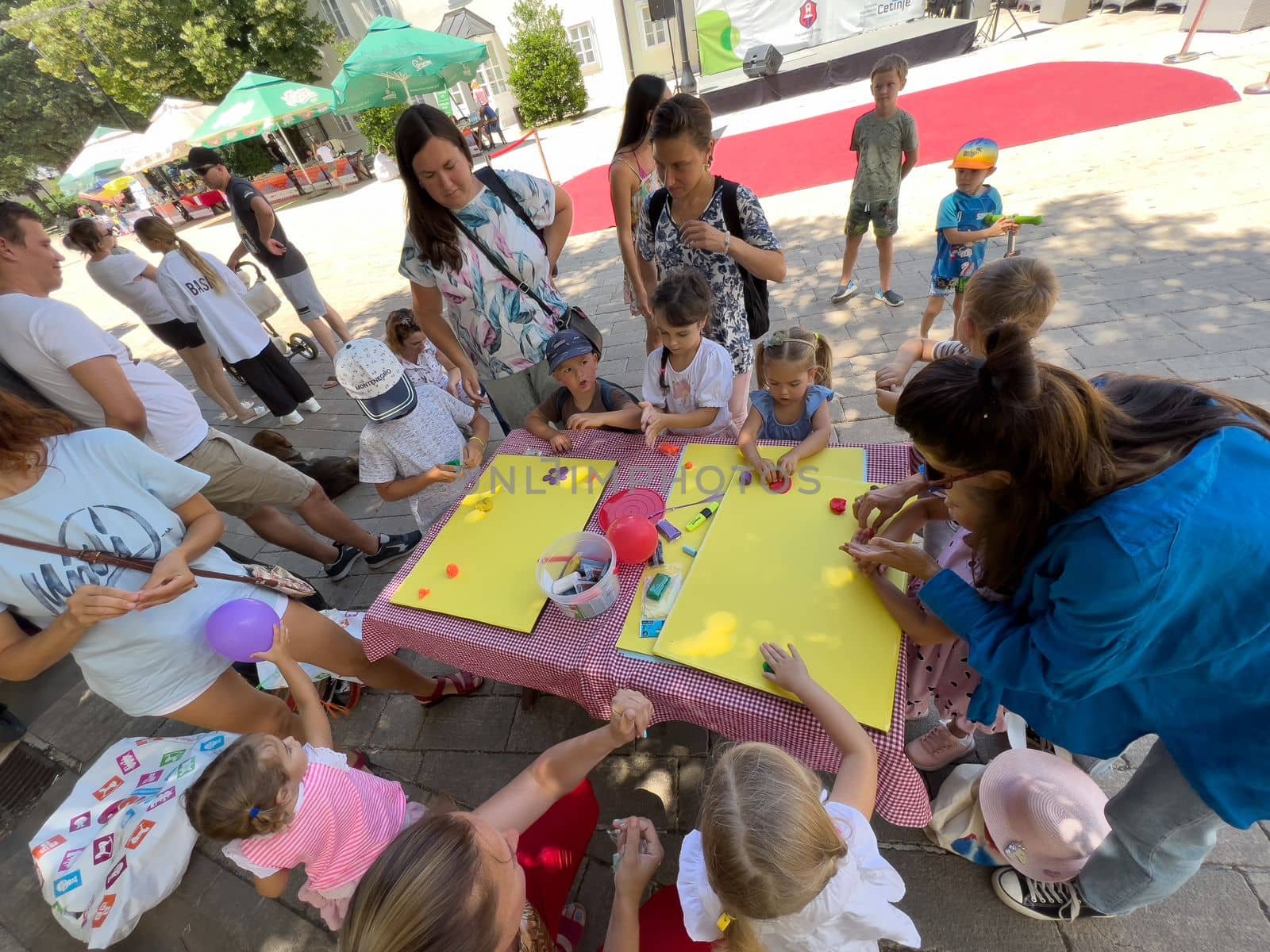 Little children draw posters on the table in the street in protest. High quality photo