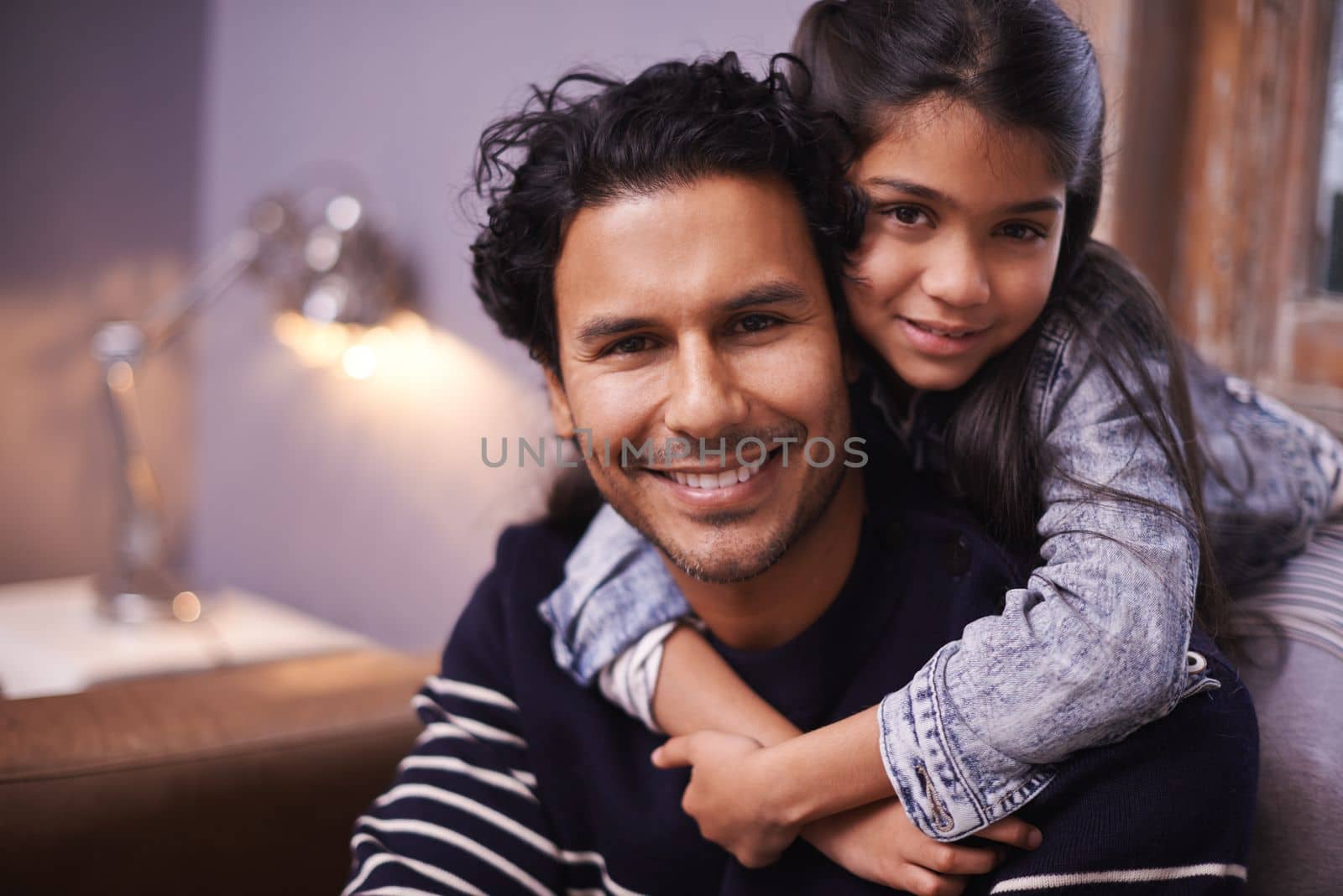 Every moment with her is precious. Portrait of a loving father and daughter at home