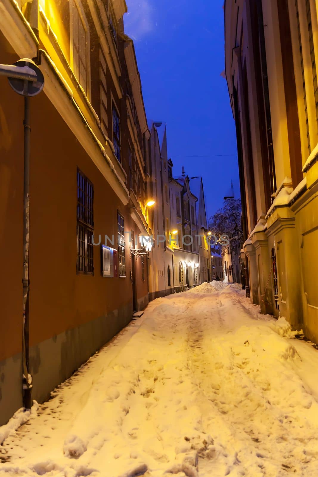 Illuminated street in the city. Christmas decorations in the old town Riga, Latvia.