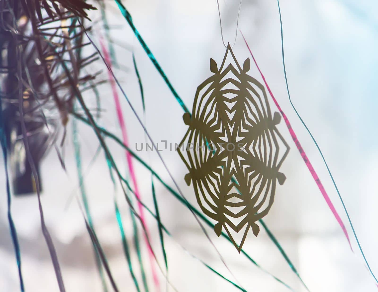 Paper snowflakes in home interior. Christmas and New year decor. by nightlyviolet