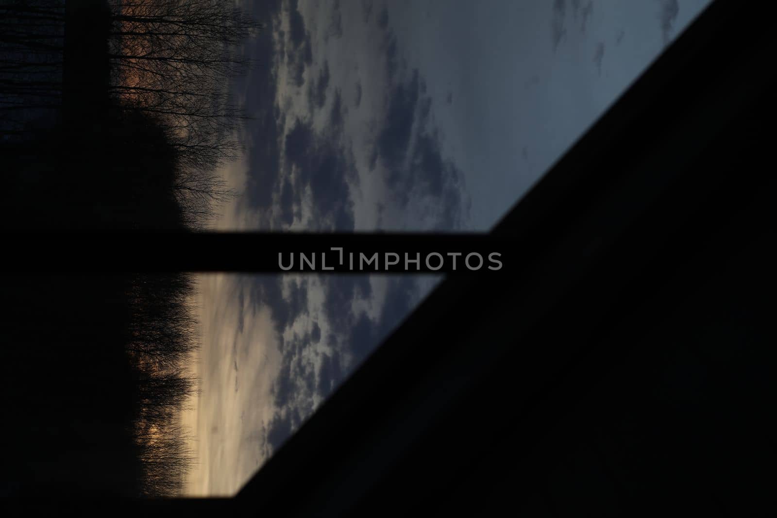 Amazing scenic panoramic sunset sky with colorful clouds through window silhouette. Gradient color. Sky texture, abstract nature background