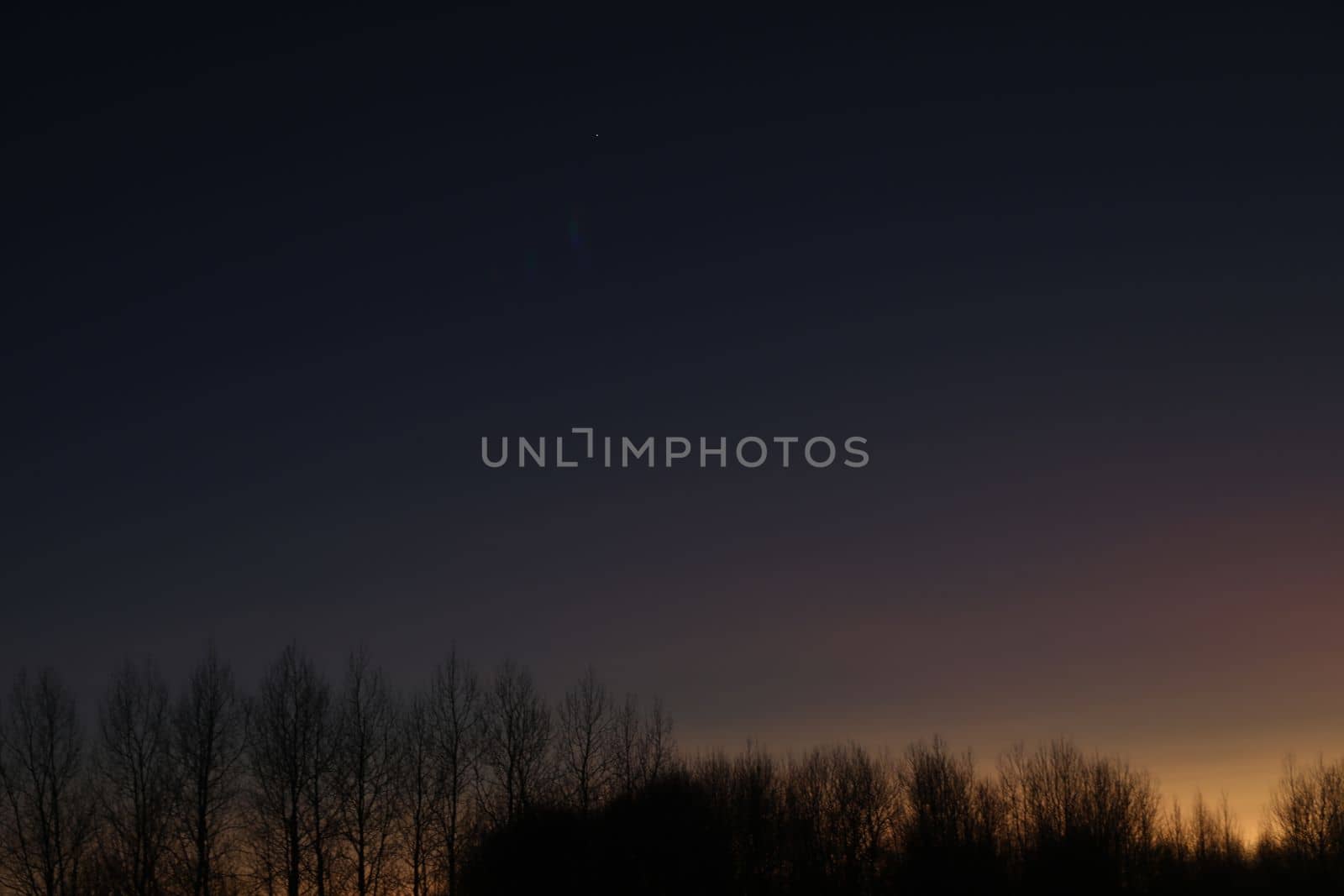 Real amazing panoramic sunrise or sunset sky with colorful clouds. Gradient color. Sky texture, abstract nature background.