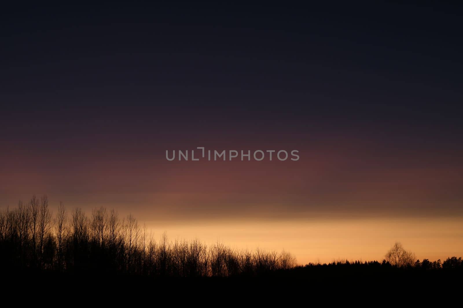 Real amazing panoramic sunrise or sunset sky with colorful clouds. Gradient color. Sky texture, abstract nature background.