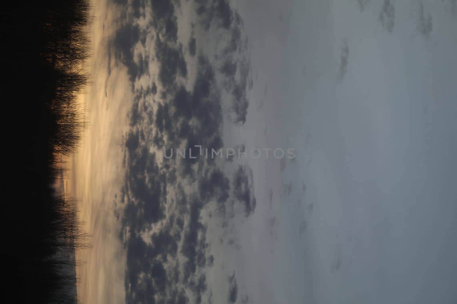 Real amazing panoramic sunrise or sunset sky with colorful clouds. Gradient color. Sky texture, abstract nature background.