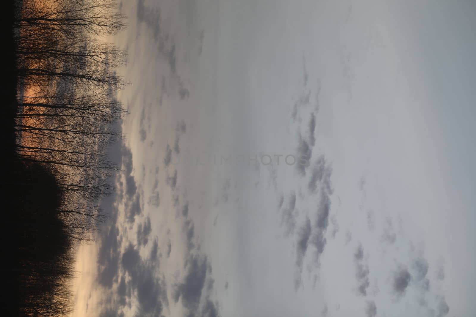 Real amazing panoramic sunrise or sunset sky with colorful clouds. Gradient color. Sky texture, abstract nature background.