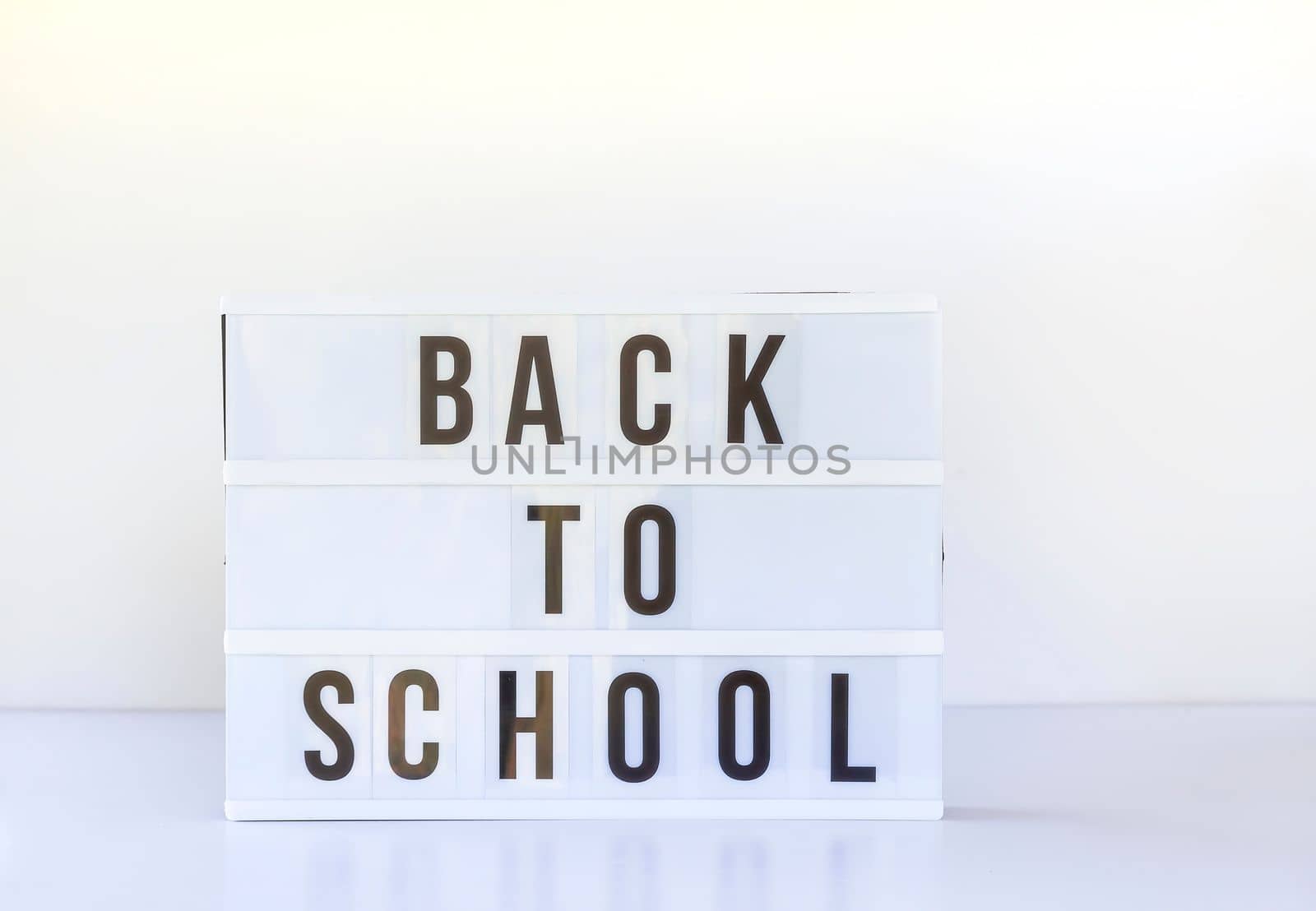 Back to school background. Words on the white lightbox. by nightlyviolet