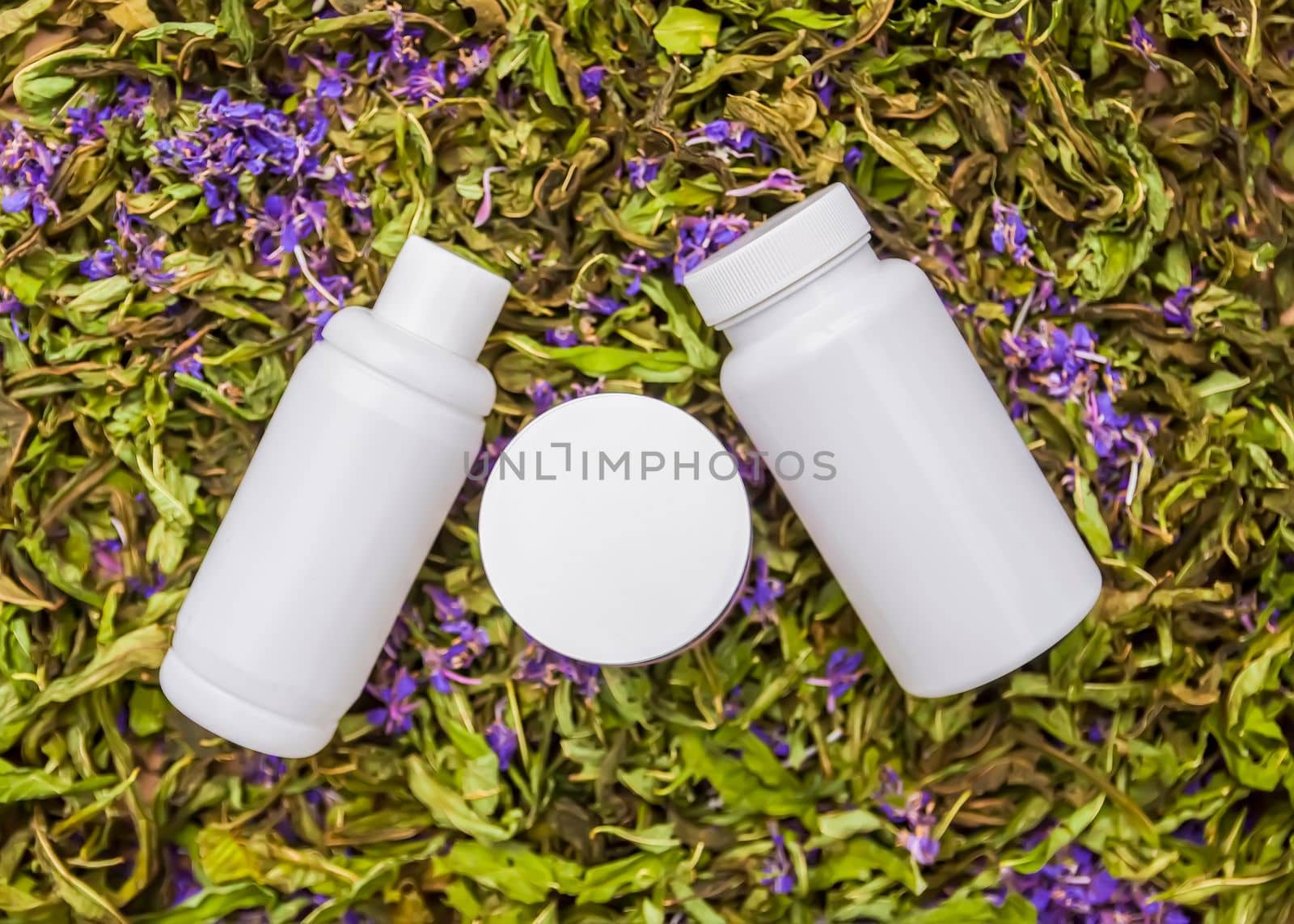 White plastic containers on dried flowers of the Blooming sally, Epilobium angustifolium plant, Fireweed or Rosebay Willowherb. by nightlyviolet
