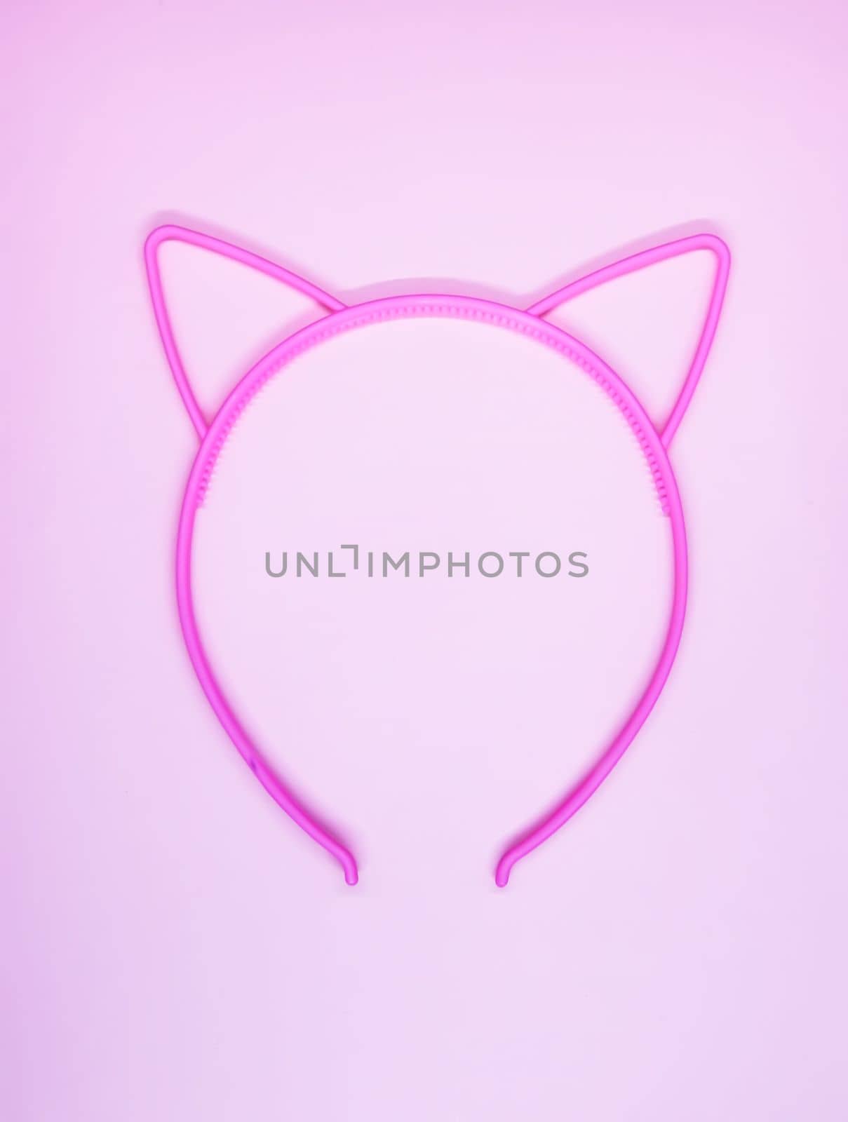 Pink plastic hoop with cute ears for hair.