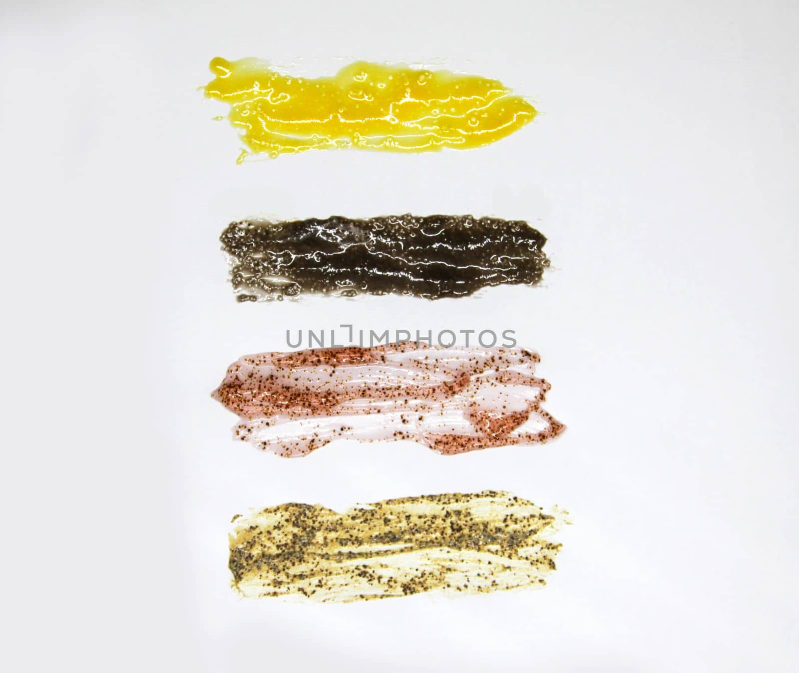 Body scrub textures. Skin care product swatch smear on white background.