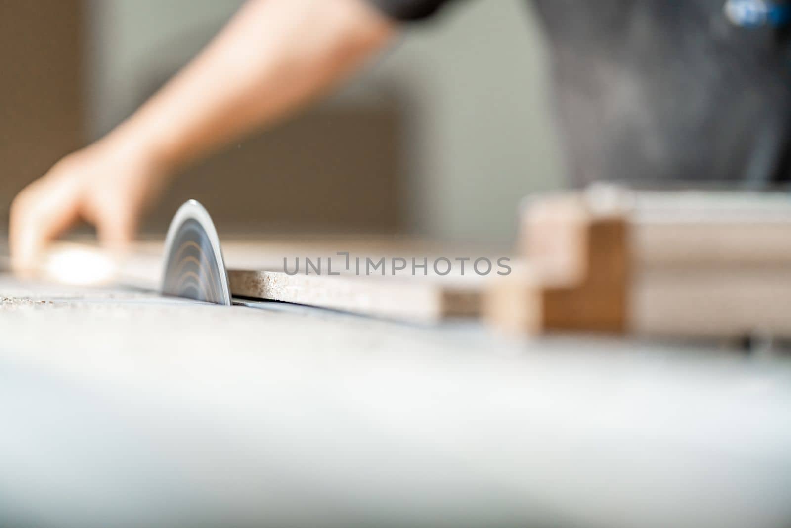 cutting laminate for the production of furniture on a circular saw.