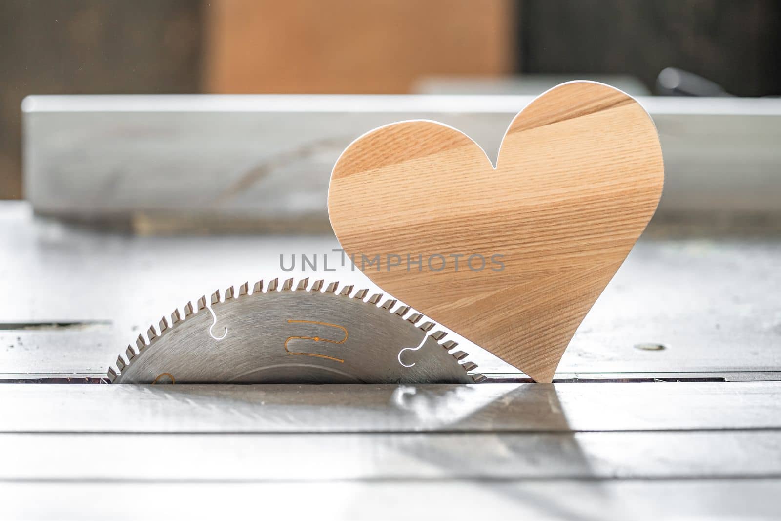 a heart made of wood on a circular in the joinery. I love wood. High quality photo