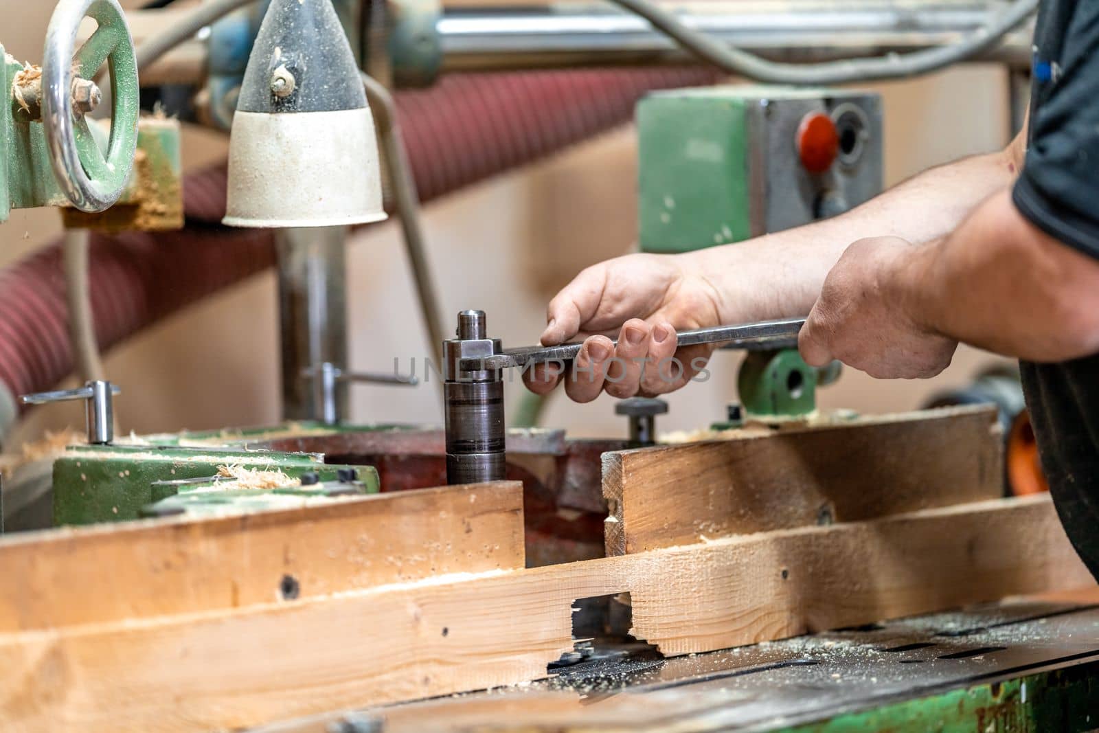 replacement of knives on a milling machine in a joinery. High quality photo