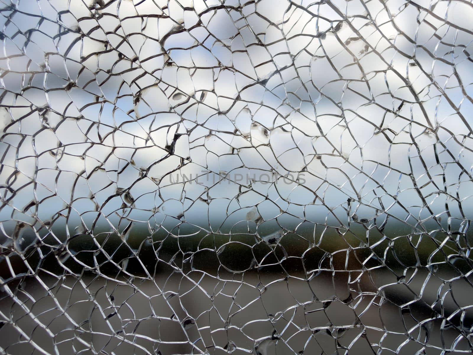 Useful texture overlay. A broken glass on. with many sharp shards. Useful texture overlay for background.