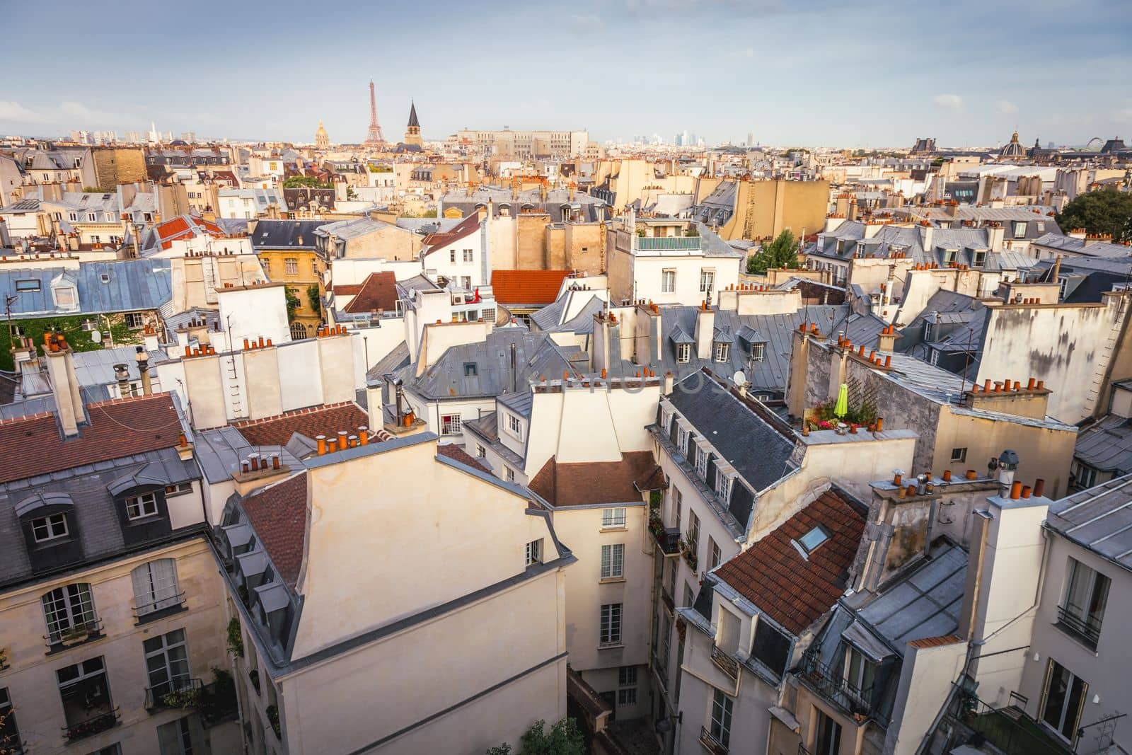 Saint-Germain-des-Pres and french roofs architecture from above at sunrise from quartier latin, Paris, France