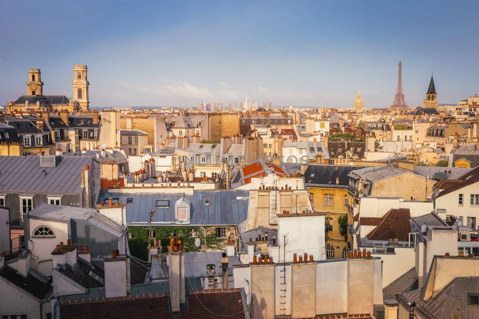 Saint-Germain-des-Pres and french roofs architecture from above at sunrise from quartier latin, Paris, France