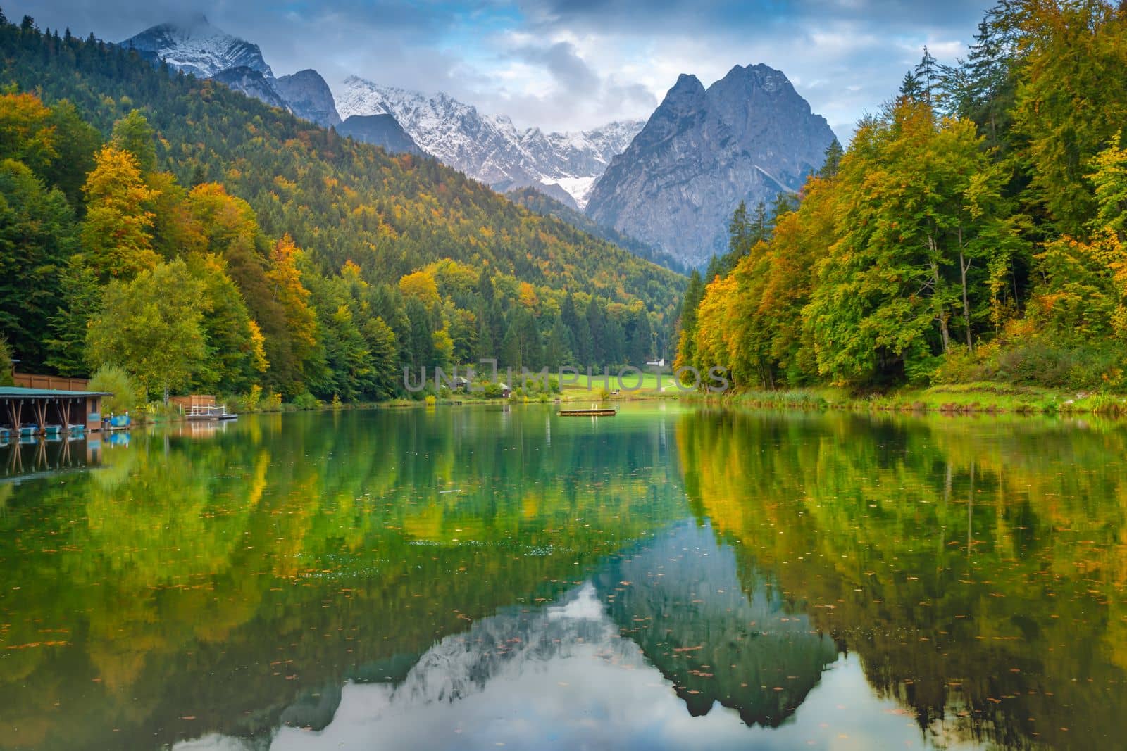 Riessersee alpine turquoise lake reflection at sunrise, Garmisch, Bavarian alps, Germany