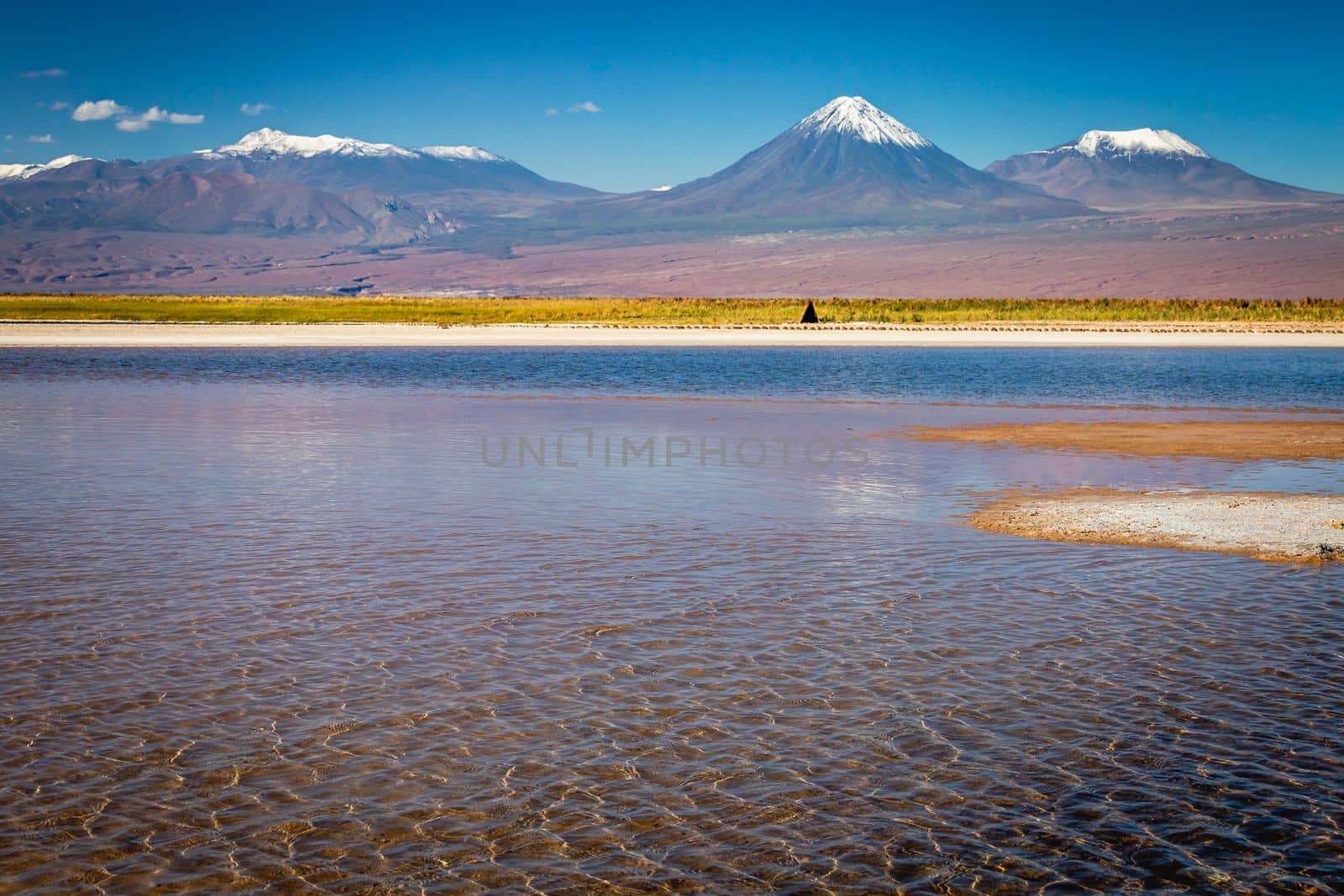 Licancabur and Peaceful reflection lake with dramatic volcanic landscape at Sunset, Atacama Desert, Chile