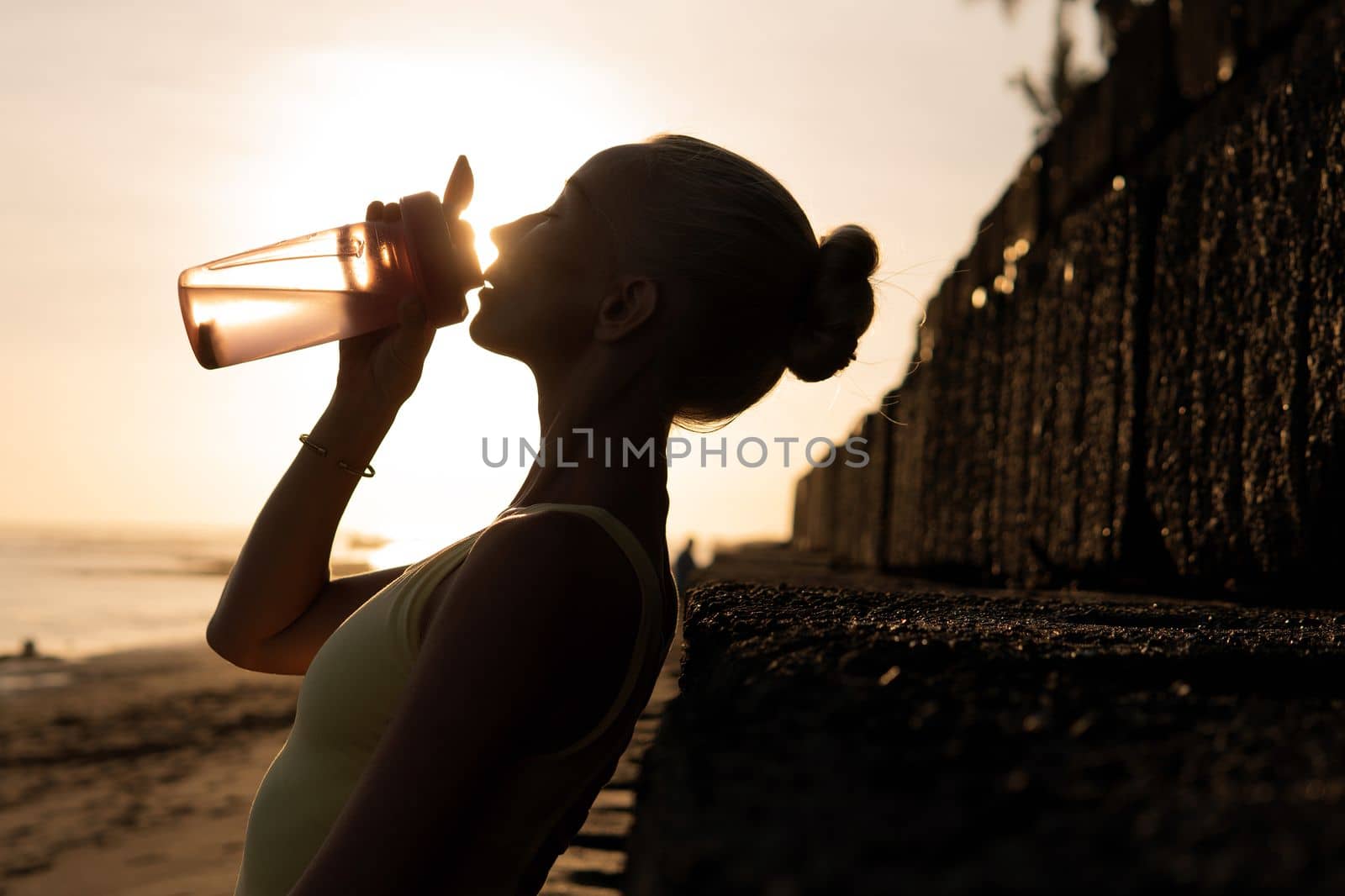 beautiful woman drinking water. bali