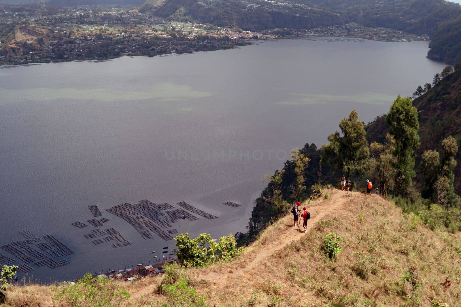 a group of people walking on the trek. bali