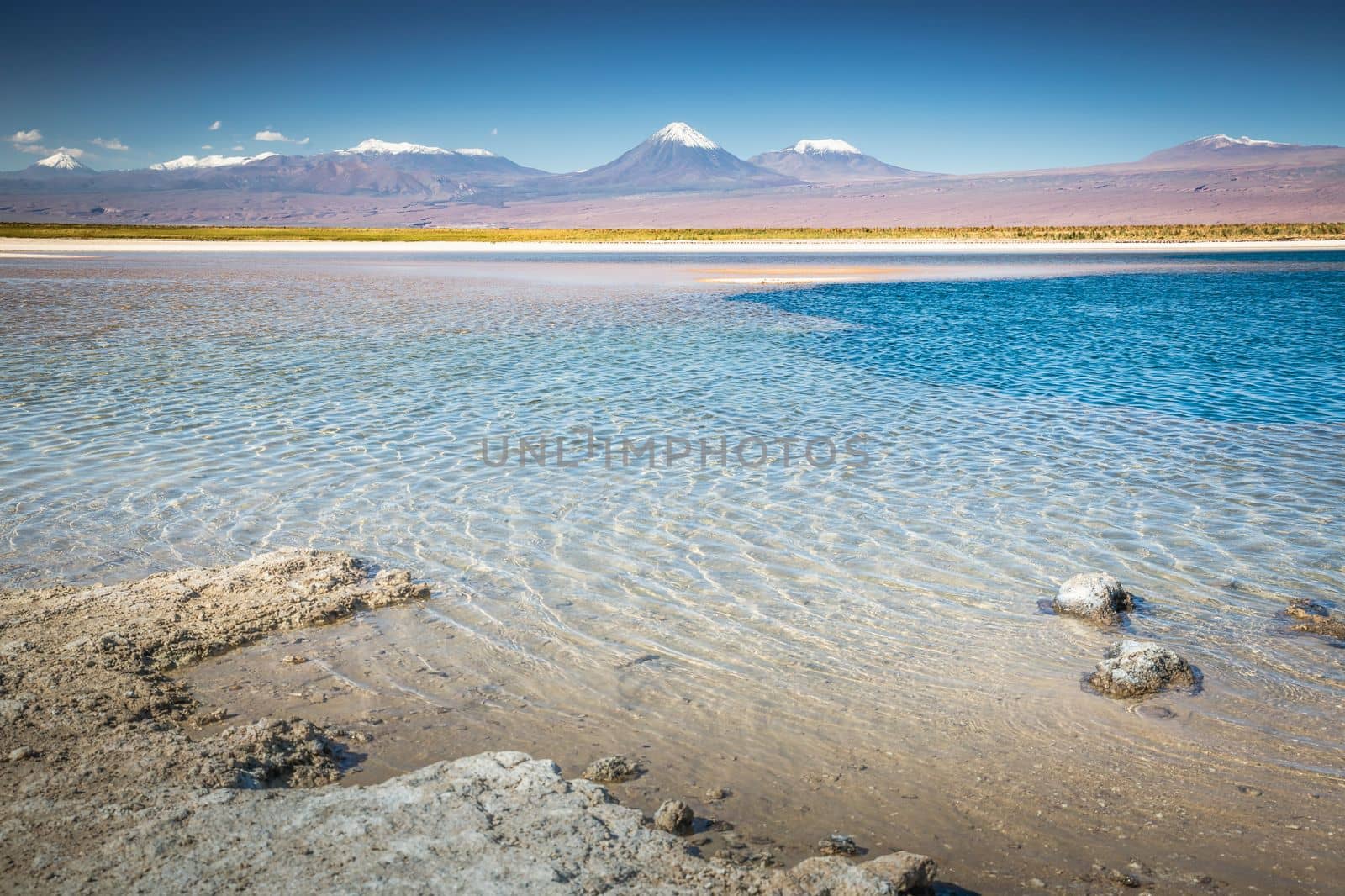 Licancabur and Peaceful reflection lake with dramatic volcanic landscape at Sunset, Atacama Desert, Chile