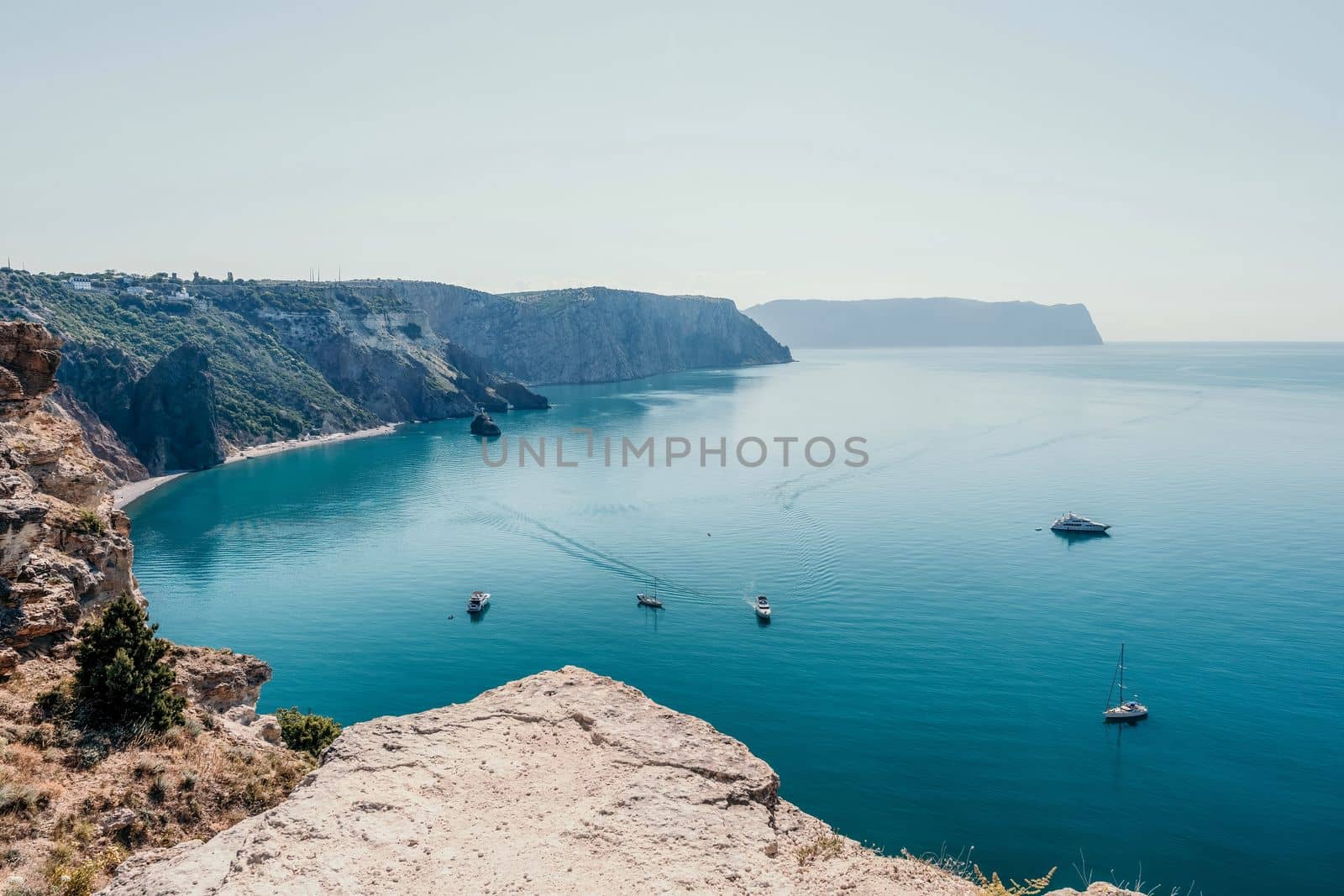 Aerial panoramic view of beautiful sunset above sea. Beautiful seascape. Sun glare, small waves on the water surface. Evening. Horizon. Nobody. No people. Copy space. Never-ending beauty of nature