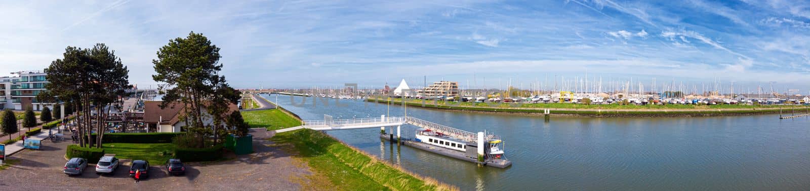 panoramic highangle view on the marina of Nieuwpoort in a spring light with boats on the shore
