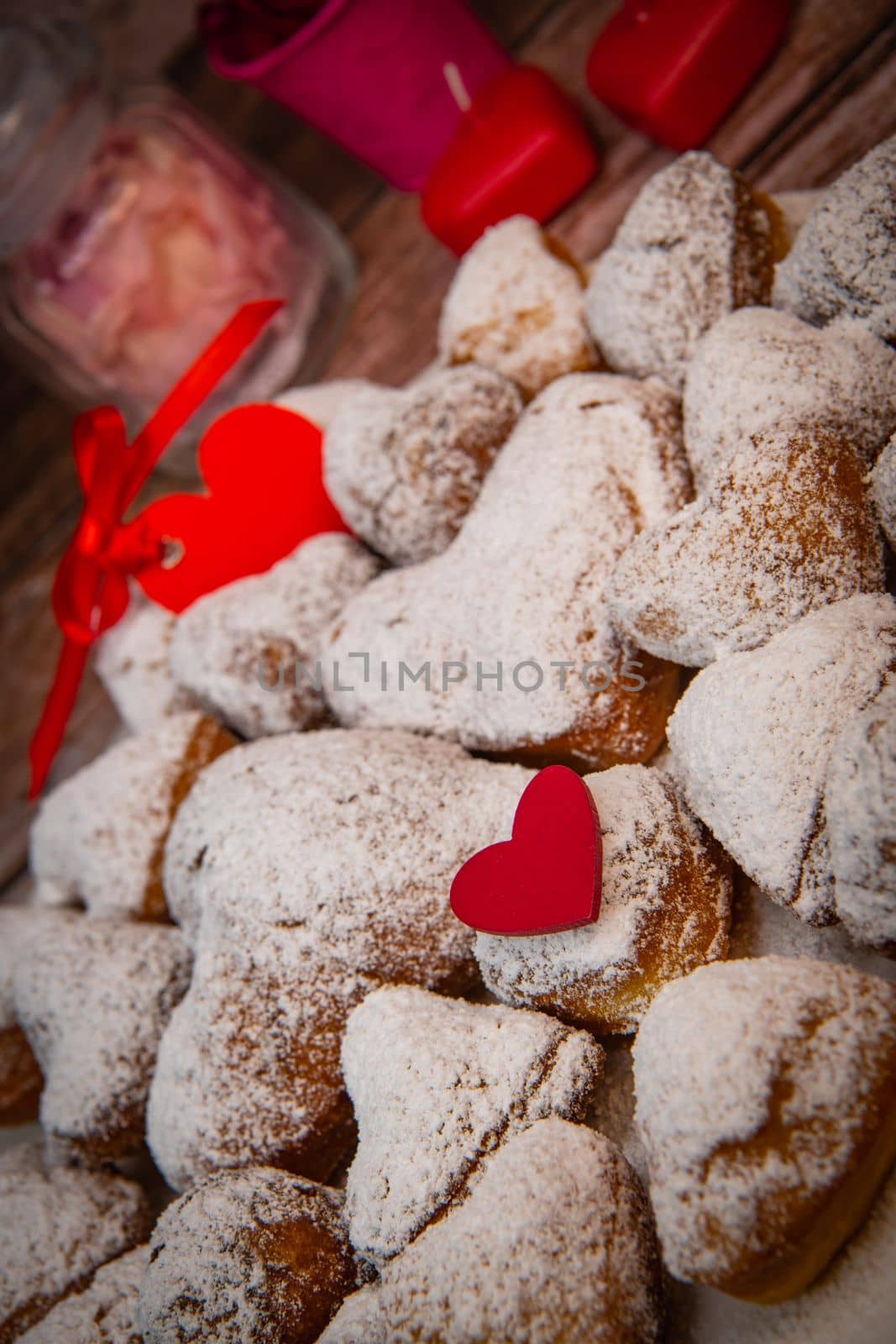 Recipe for soft heart-shaped doughnuts for Valentine's Day. High quality photo