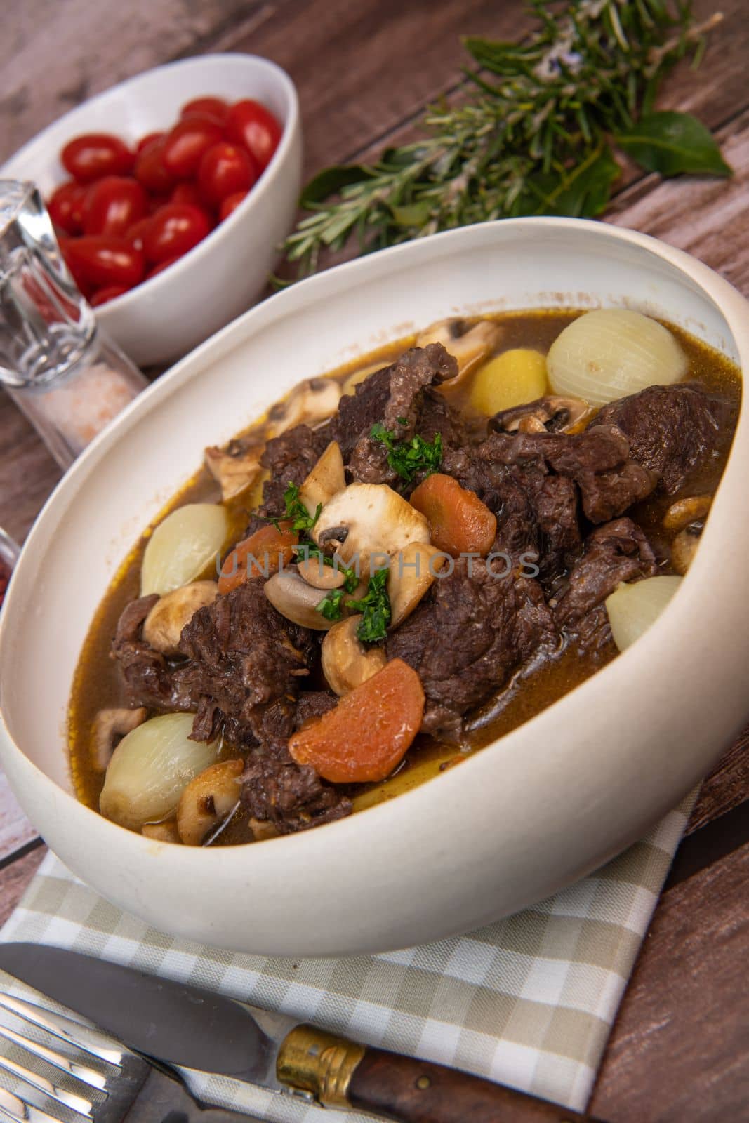 Beef bourguignon recipe, beef stew with wine sauce and vegetables. High quality photo
