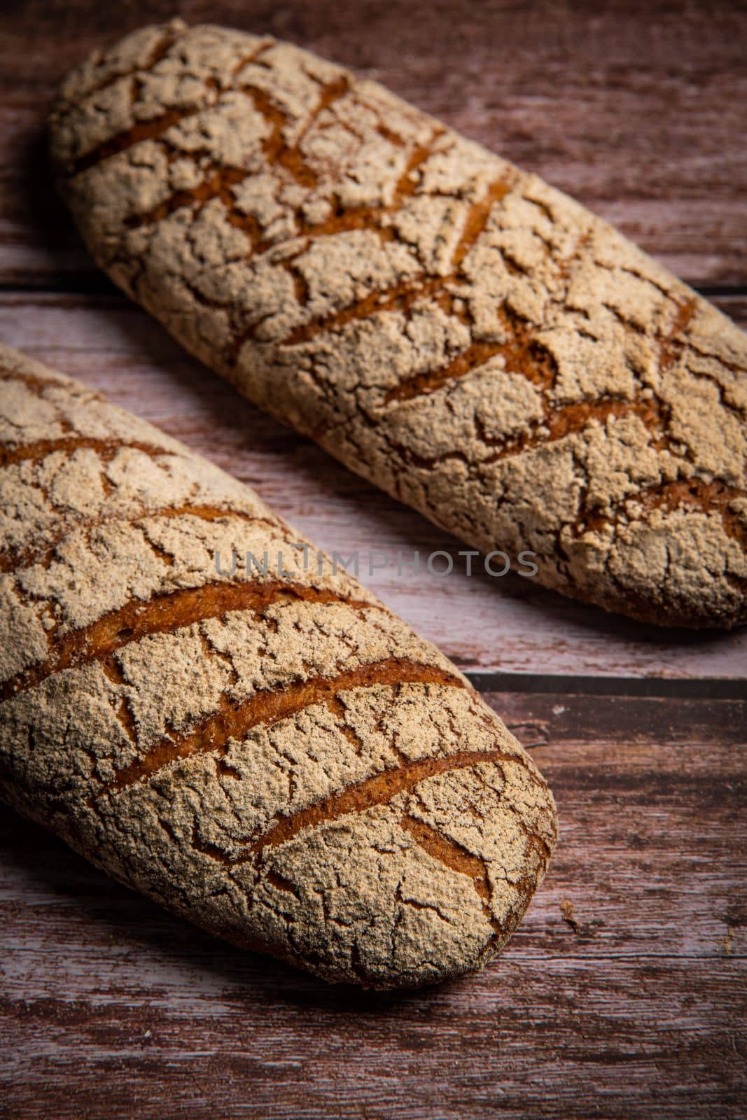Rye bread on brown background. High quality photo