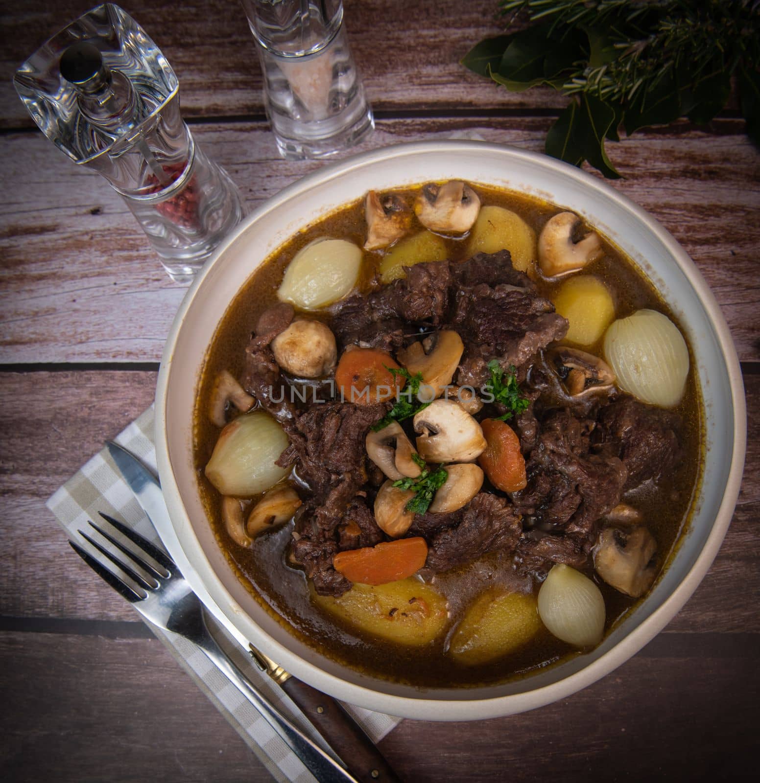 Beef bourguignon recipe, beef stew with wine sauce and vegetables. High quality photo