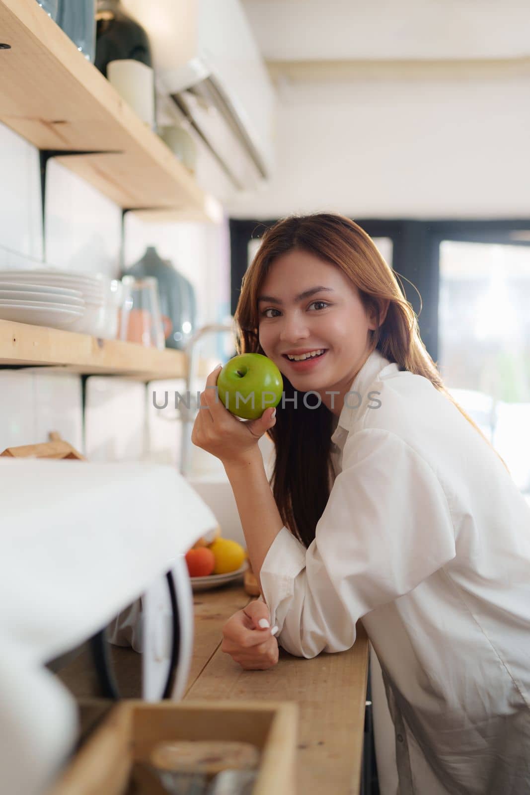 Portrait of Beautiful asian woman eating healthy food salad at kitchen room at house.