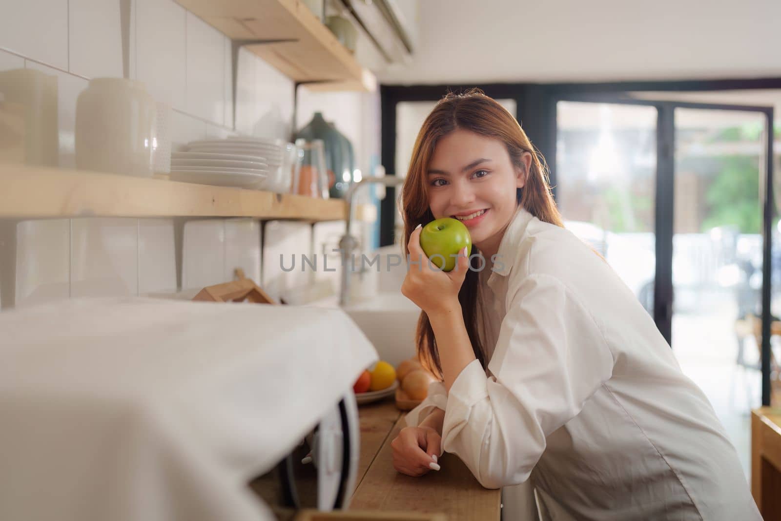 Portrait of Beautiful asian woman eating healthy food salad at kitchen room at house.