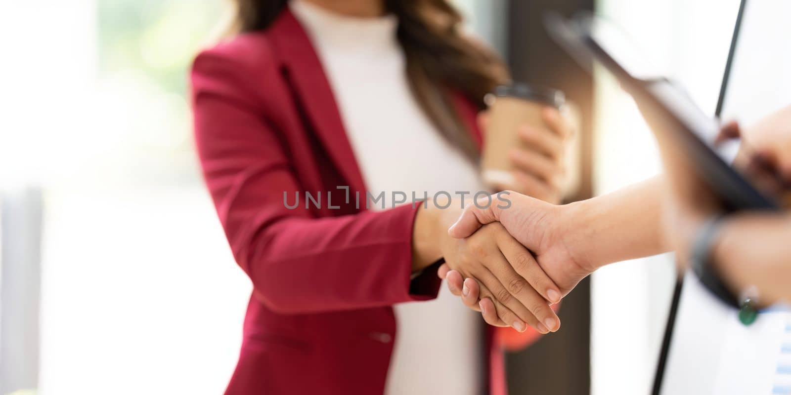 Business people shaking hands, finishing up meeting, business etiquette, congratulation, merger and acquisition concept by nateemee