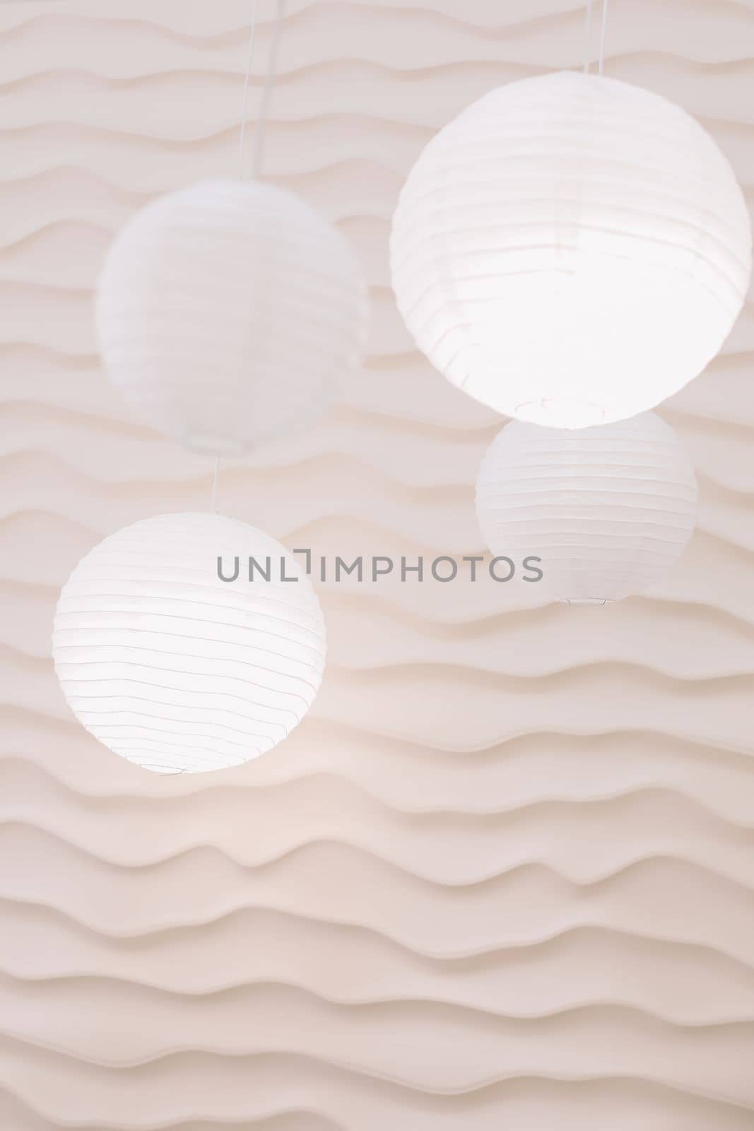 Beige paper lamps in modern interior. cozy home interior by paralisart