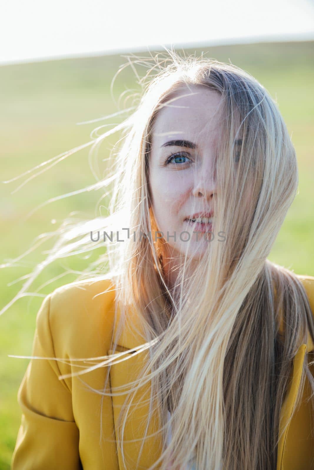 portrait of a beautiful blonde girl in a yellow jacket by Simakov