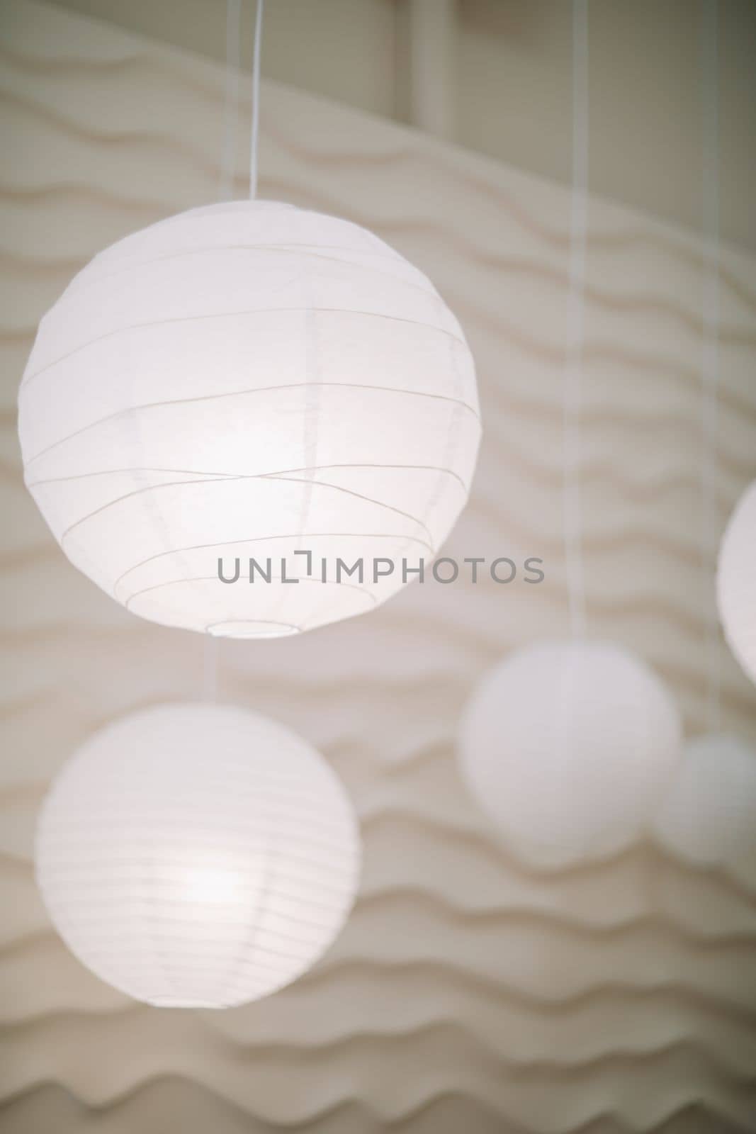 Beige paper lamps in modern interior. cozy home interior.