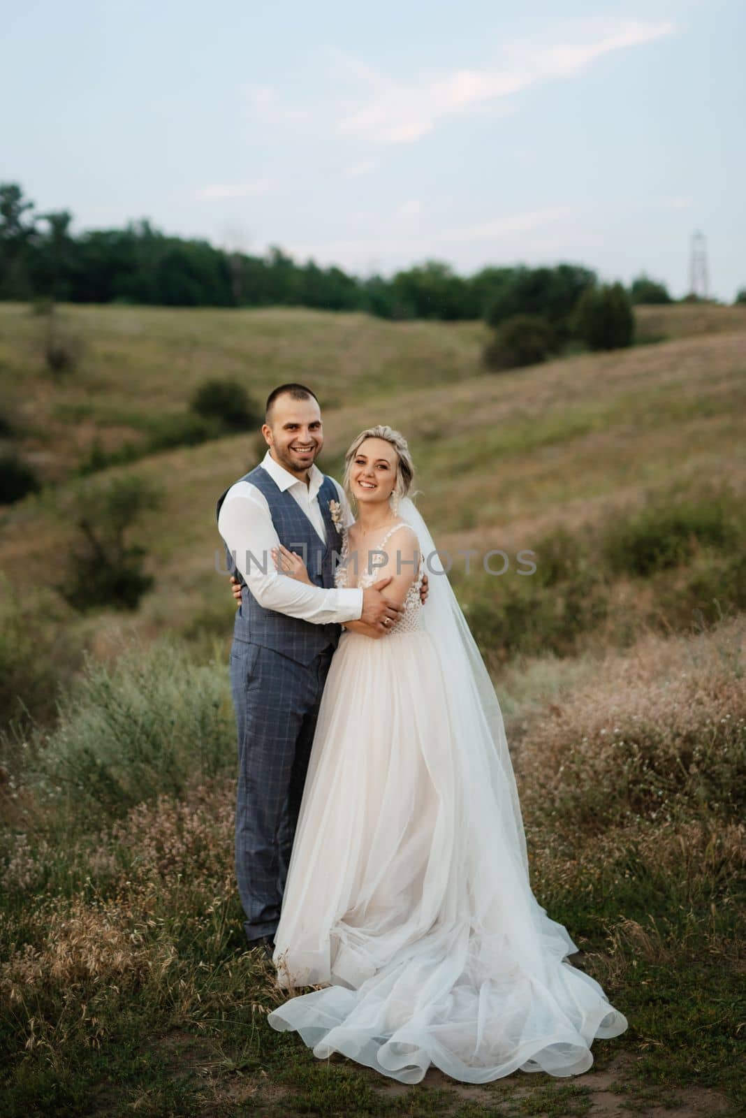 bride blonde girl and groom in a field by Andreua
