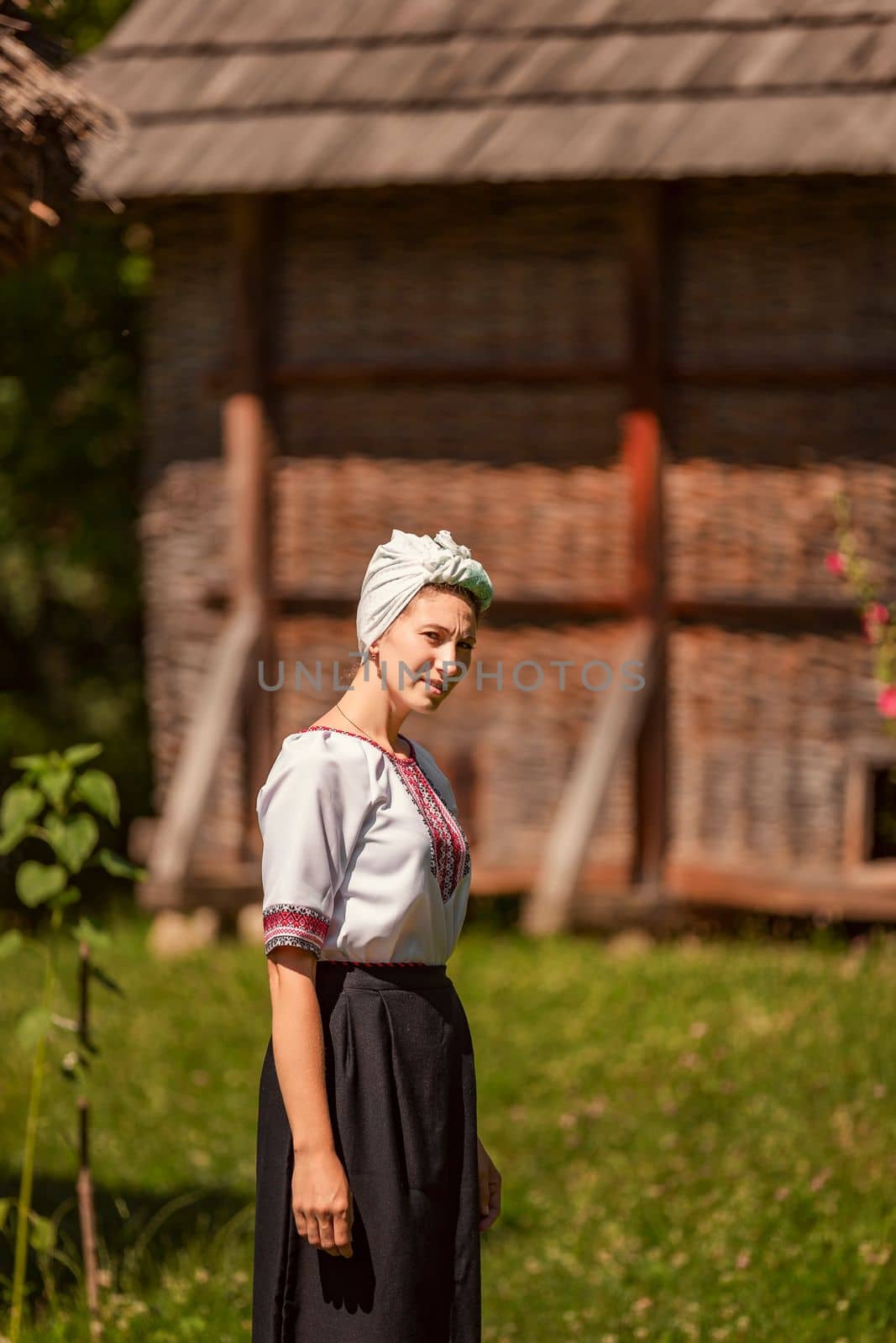 young woman in ukrainian national costume outdoors