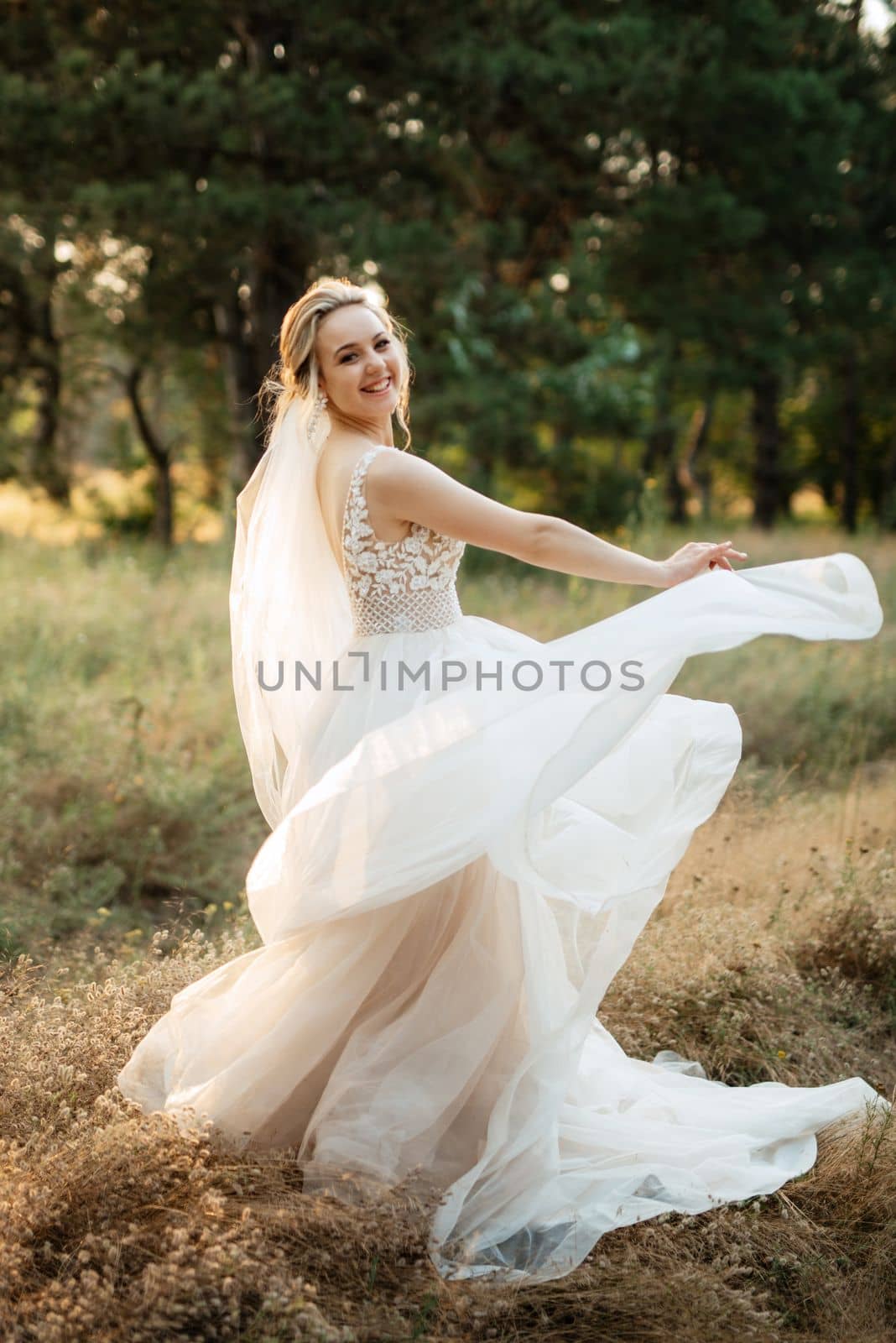 bride blonde girl with a bouquet in the forest by Andreua