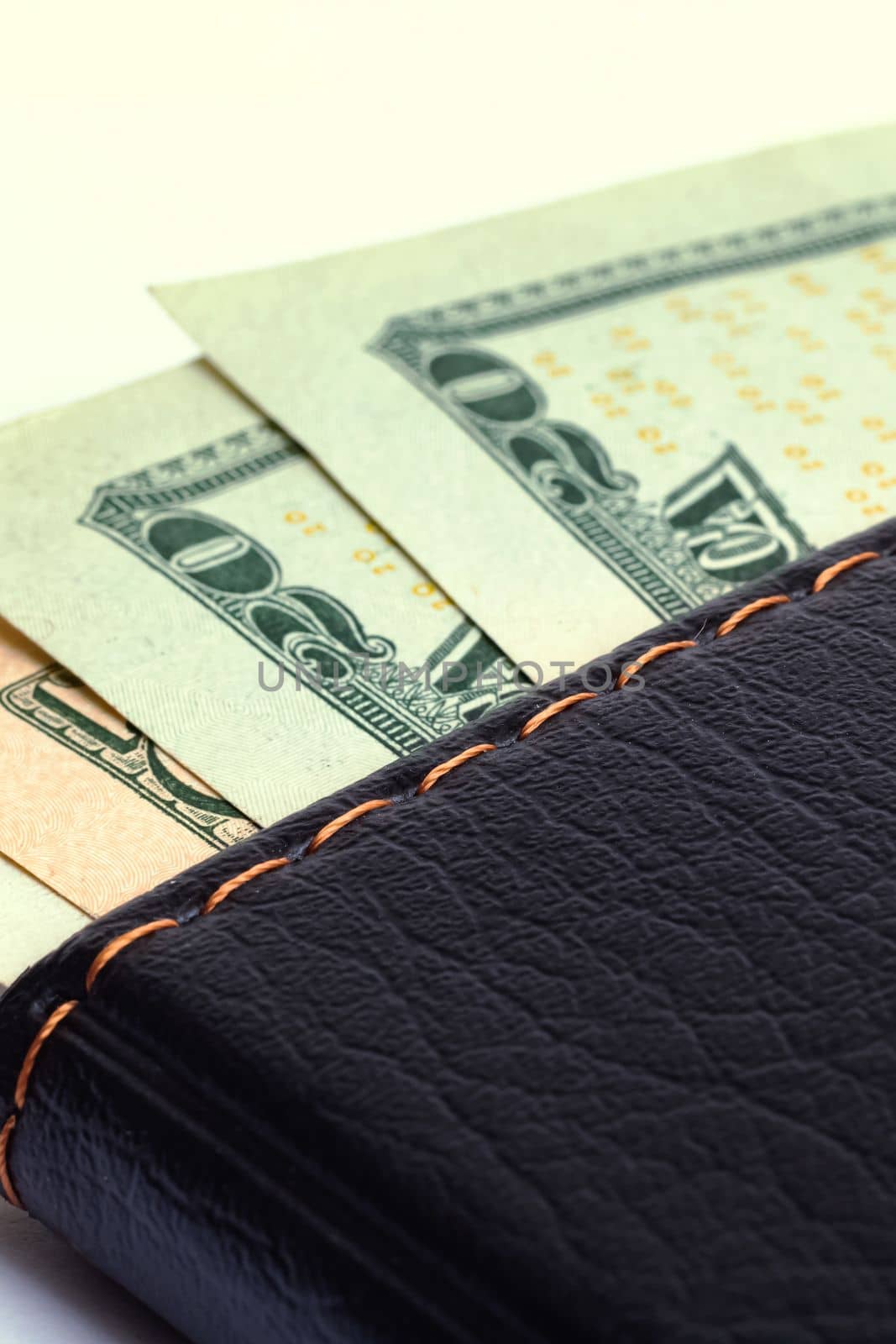 Dollars in wallet isolated on white background close up
