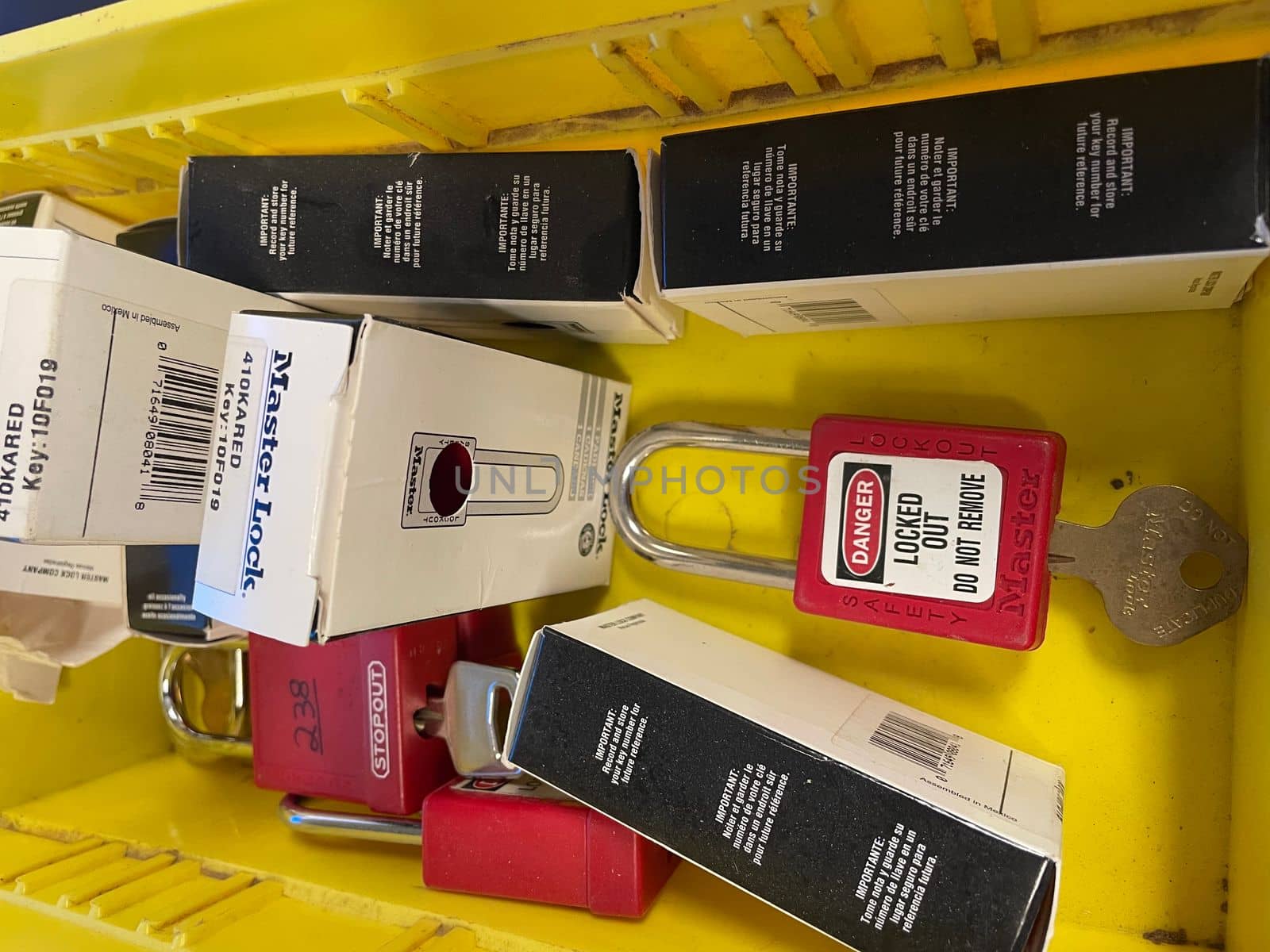 Lock out tag out locks locks in a yellow tote by gena_wells