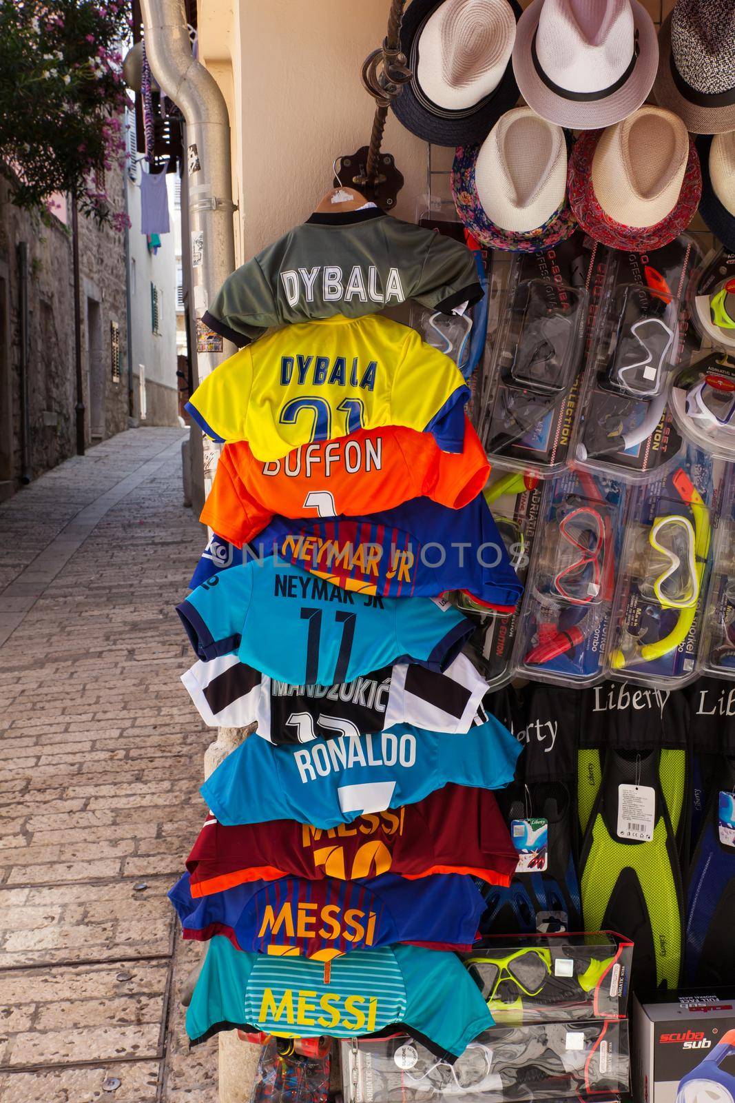 POREC, CROATIA - JULY, 14: Soccer shirts hang outside a shop on July 14, 2017