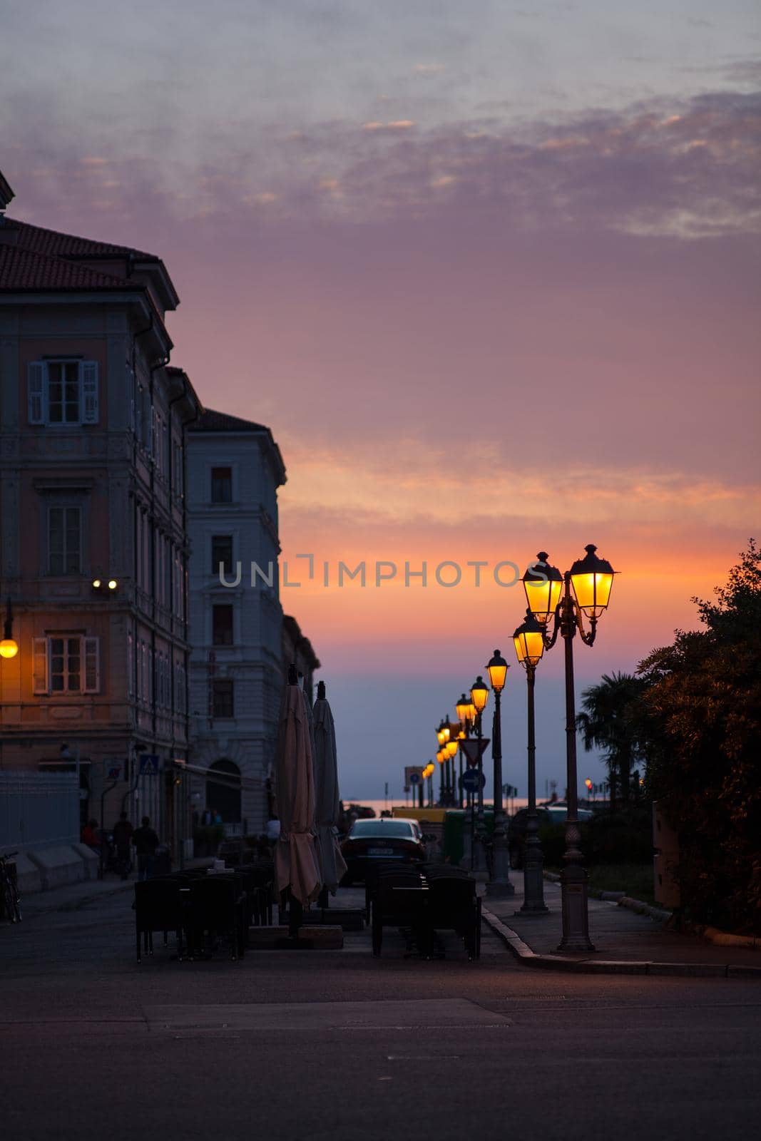 View of street lantern illuminated in Trieste, Italy