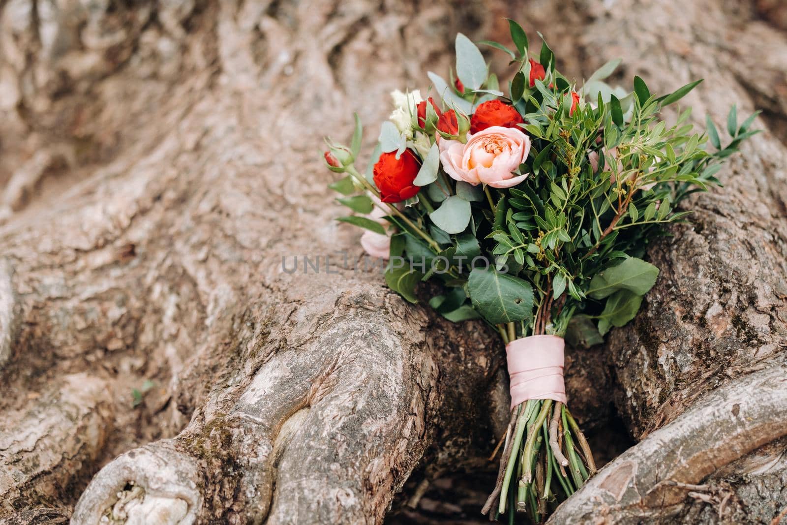 wedding bouquet with roses and boutonniere.The decor at the wedding.