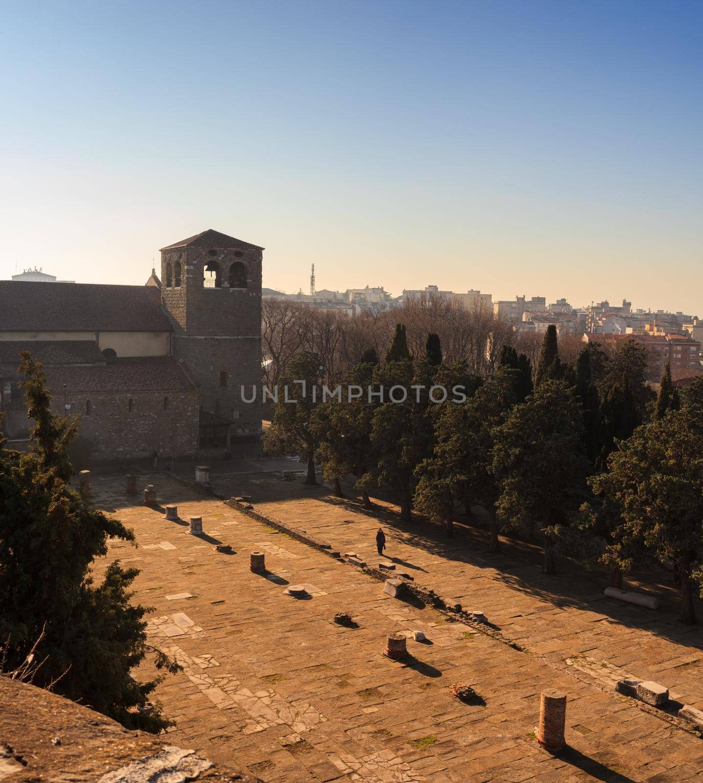 TRIESTE, ITALY - DECEMBER, 20: View of the St. Giusto cathedral and roman ruins on December 20, 2015