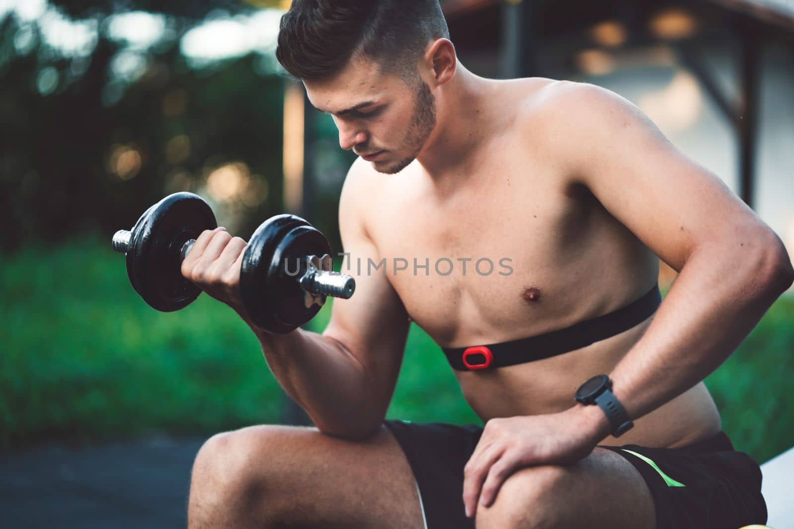 Fit man checking smart watch wearable technology sport smartwatch on workout outside. Man wearing smart watch during his training, measuring his activity. High quality photo