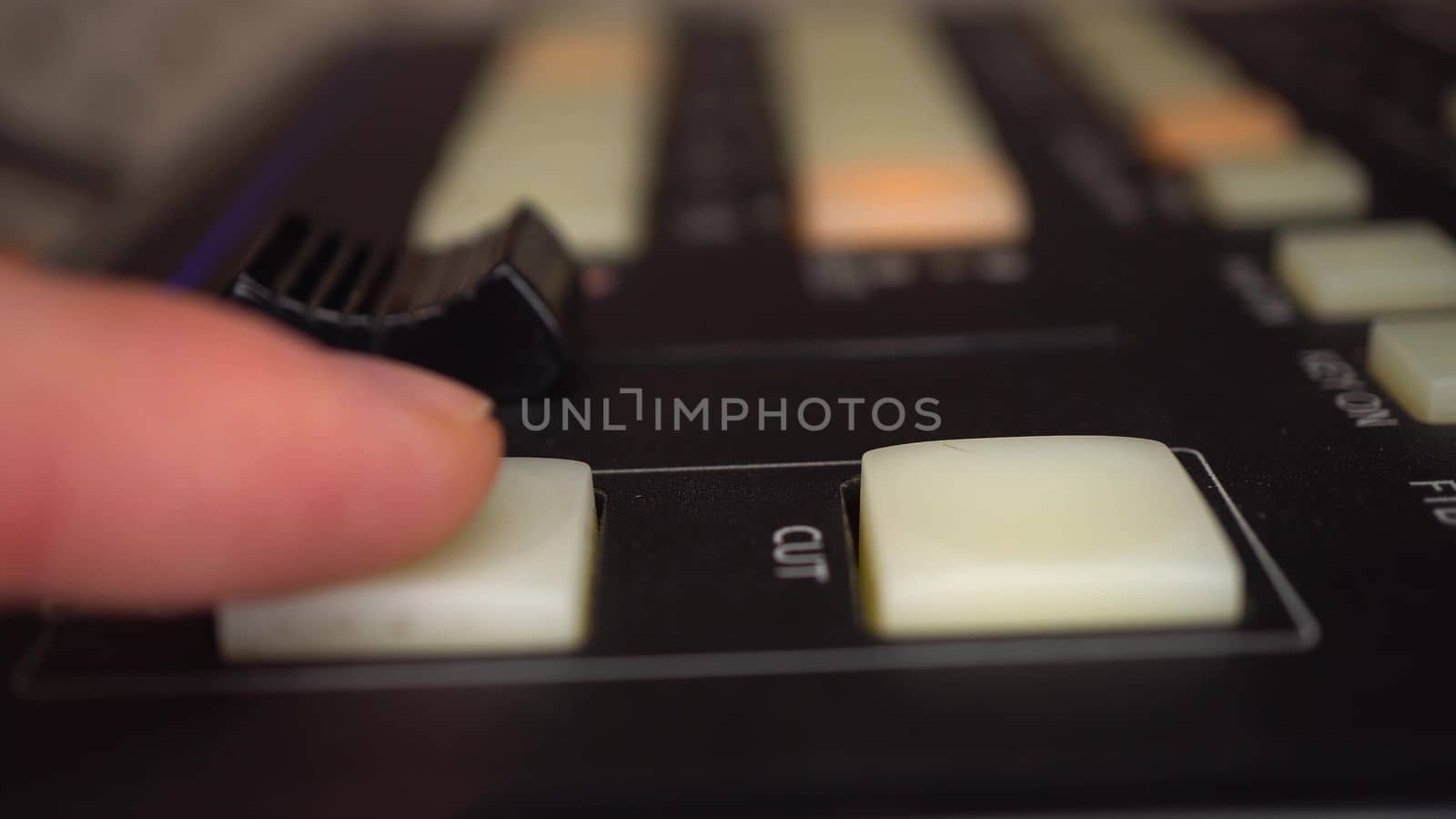 A video engineer operates a professional analog video mixer. Camera control panel. 4k