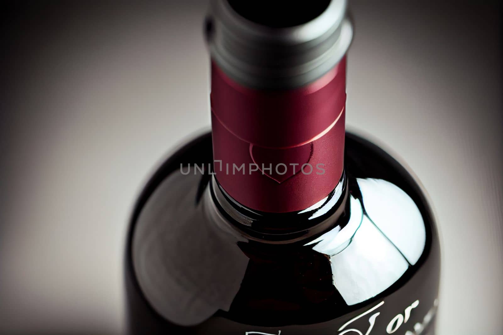 Close up shot of a bottle of wine for Valentine's Day background with copy space. Gift ideas. Design for Valentine's Day festive banner.